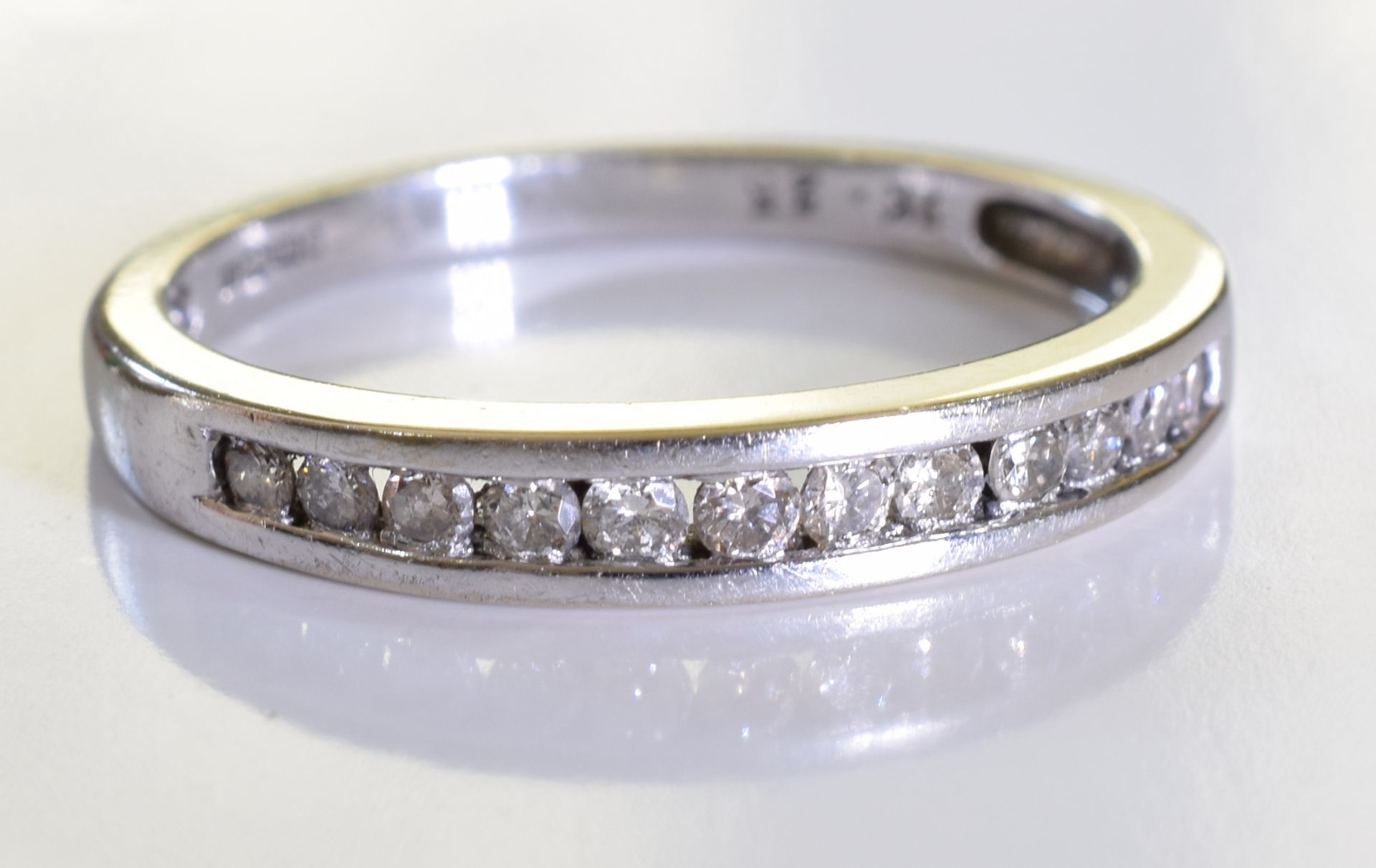 An 18ct gold diamond half-circle eternity ring. designed as a brilliant-cut diamond line, to the - Image 2 of 4