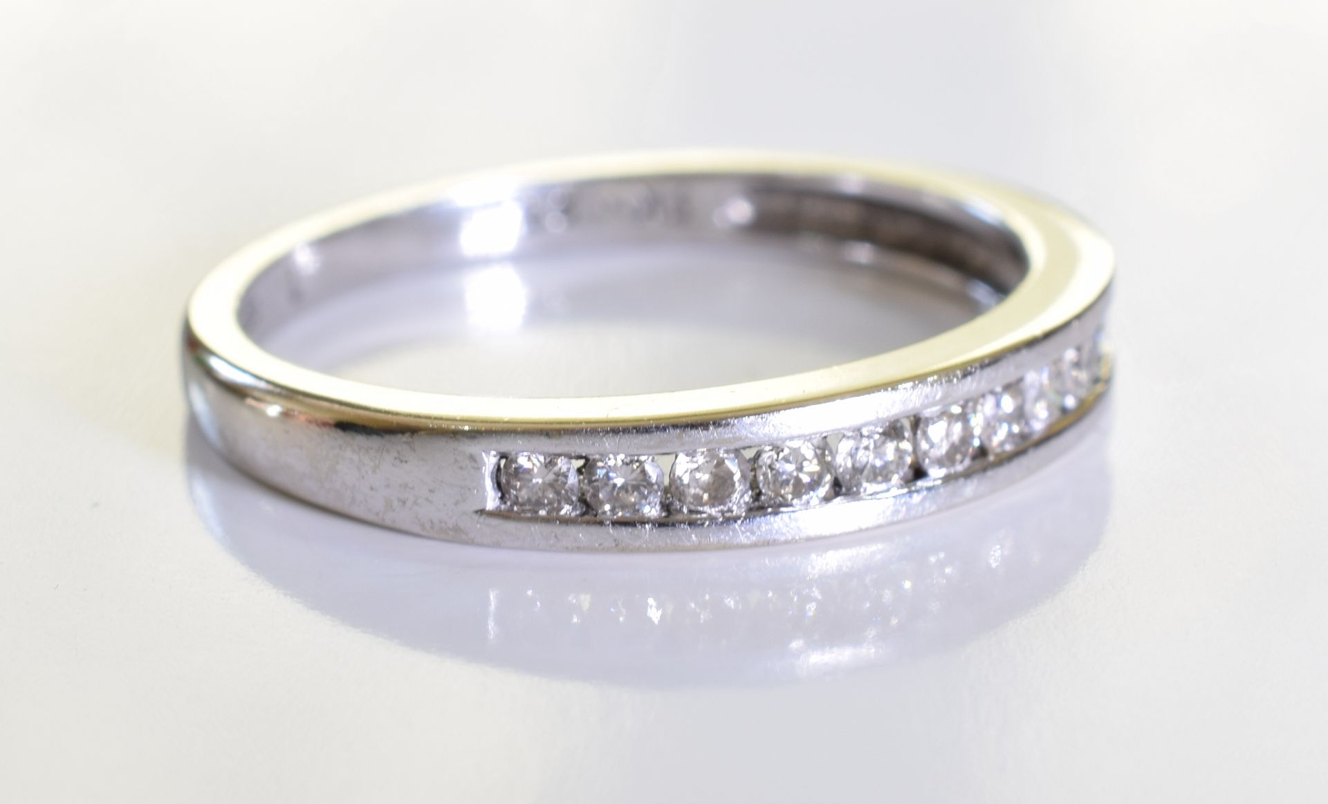 An 18ct gold diamond half-circle eternity ring. designed as a brilliant-cut diamond line, to the - Image 4 of 4