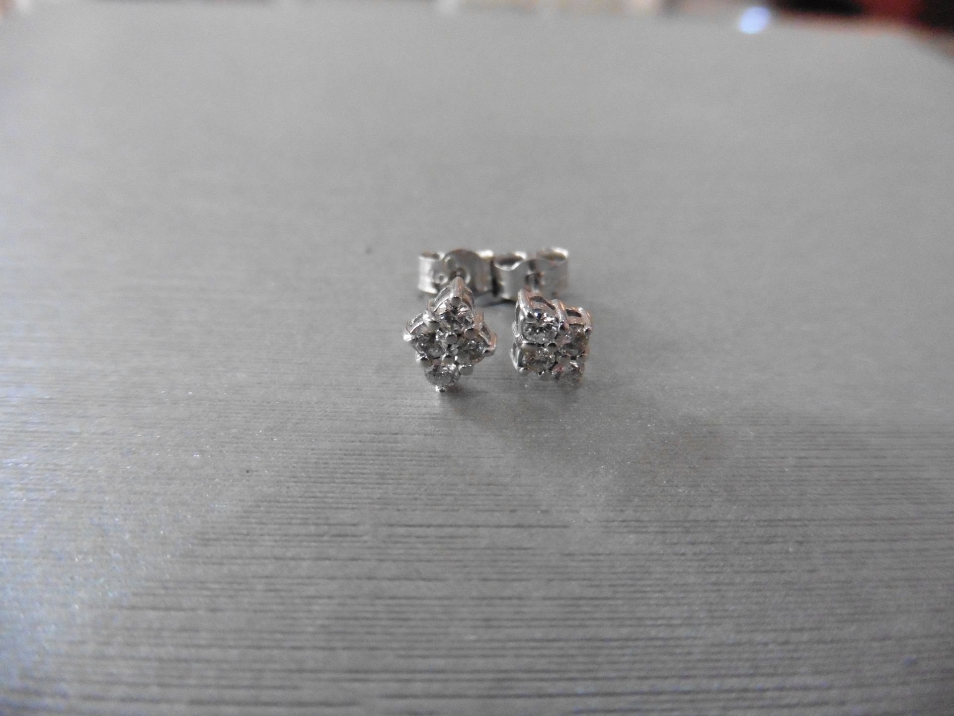 18ct white gold diamond cluster style earrings each set with 4 small brilliant cut diamonds, H