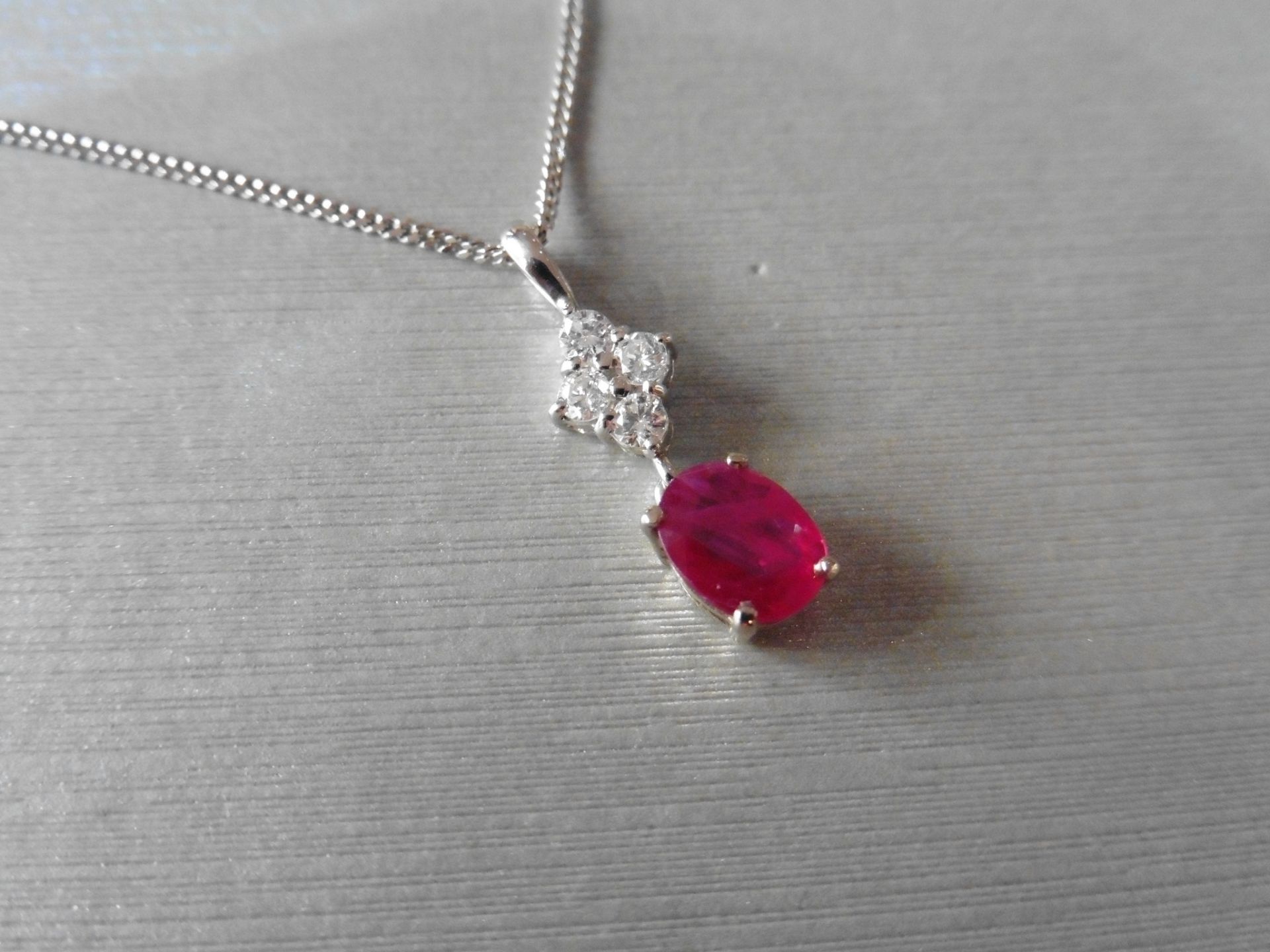 Ruby and diamond pendant set with an oval cut ruby weighing 1.50ct. Set on top are four small - Image 2 of 3