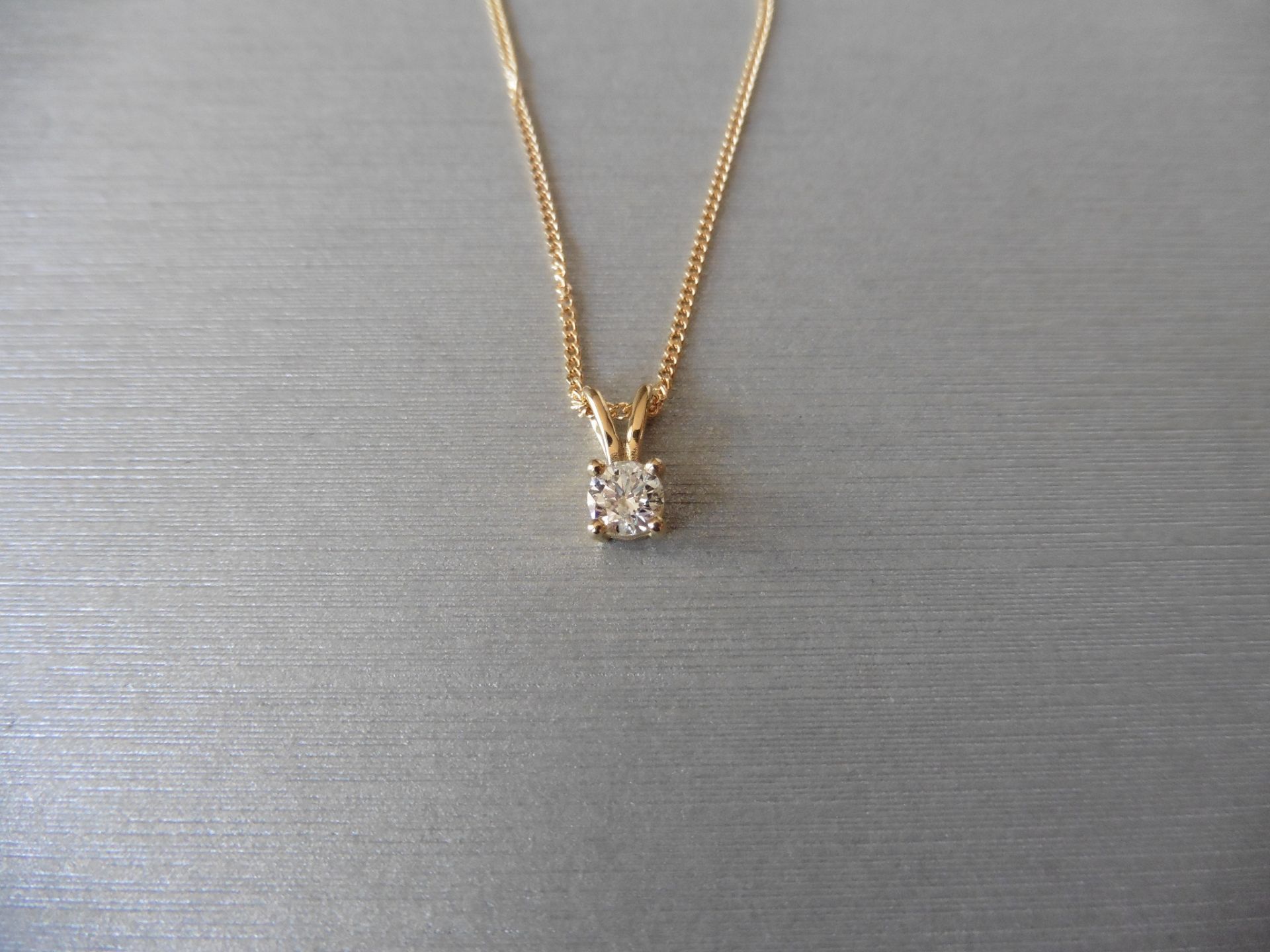 Diamond solitaire style pendant set with a single brilliant cut diamond weighing 0.50ct, H/I