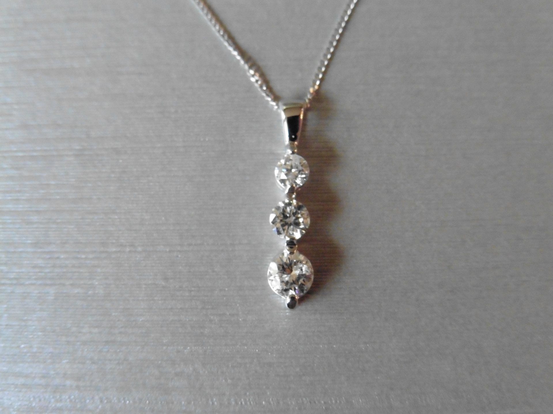 Trilogy style pendant set with 3 graduated brilliant cut diamonds, H/I colour, Si3 clarity, weighing