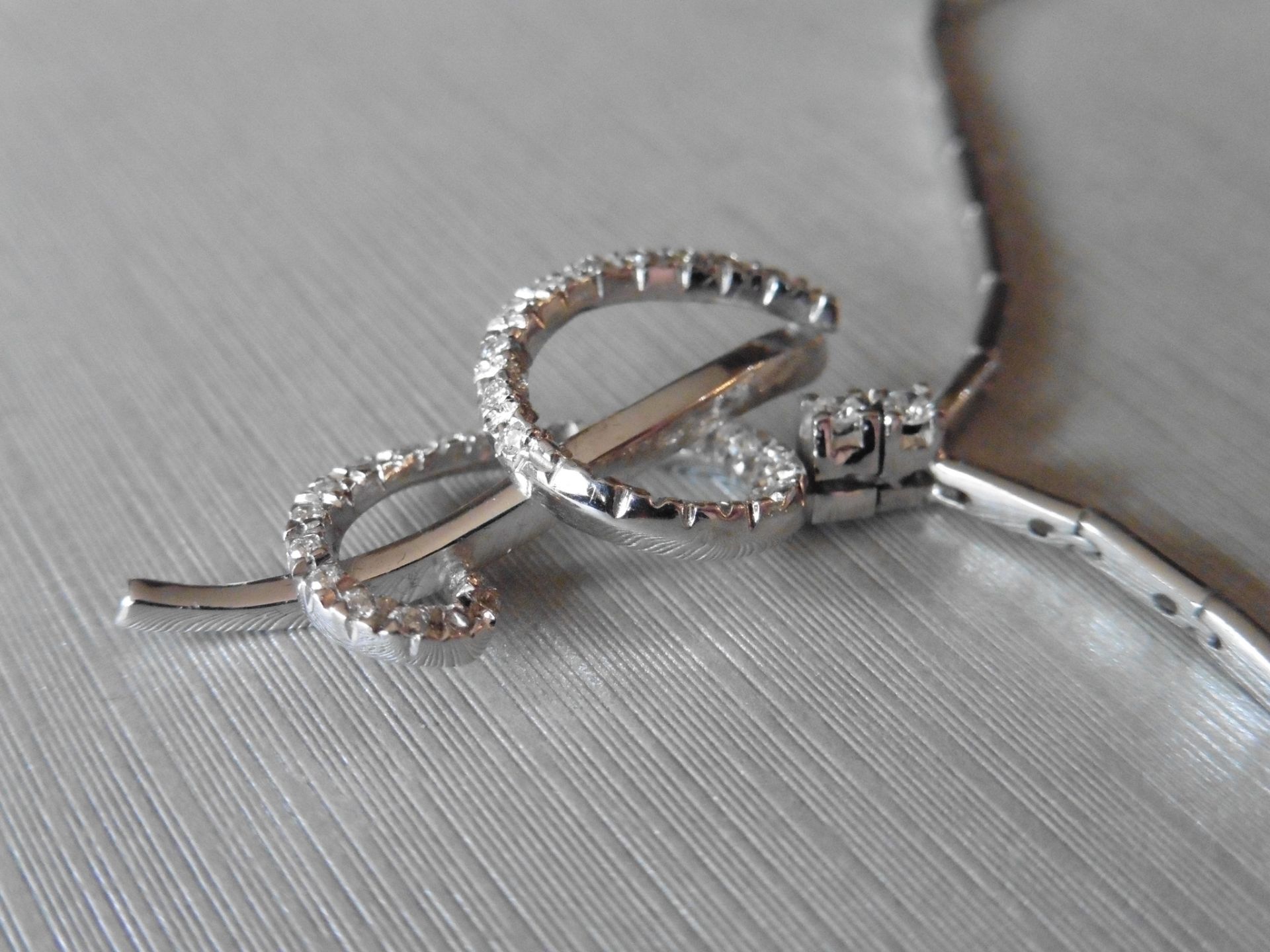 18ct white gold fancy diamond set pendant. Swirl design with small brilliant cut diamonds, H colour, - Image 3 of 6