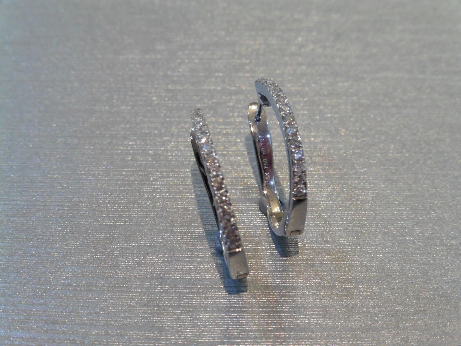 Diamond set hoop earrings. Set with small brilliant cut diamonds, weighing 0.19ct in total, H colour - Image 2 of 3