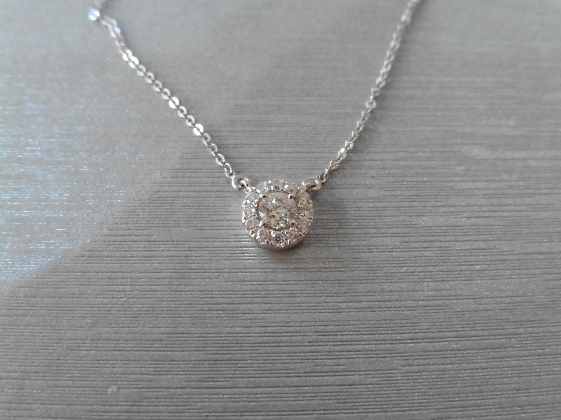 18ct white gold diamond pendant. Set with a centred 0.30ct russian cut diamond, H colour and SI2