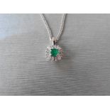 9ct white gold emerald and diamond pendant set with a round cut emerald which is surrounded with