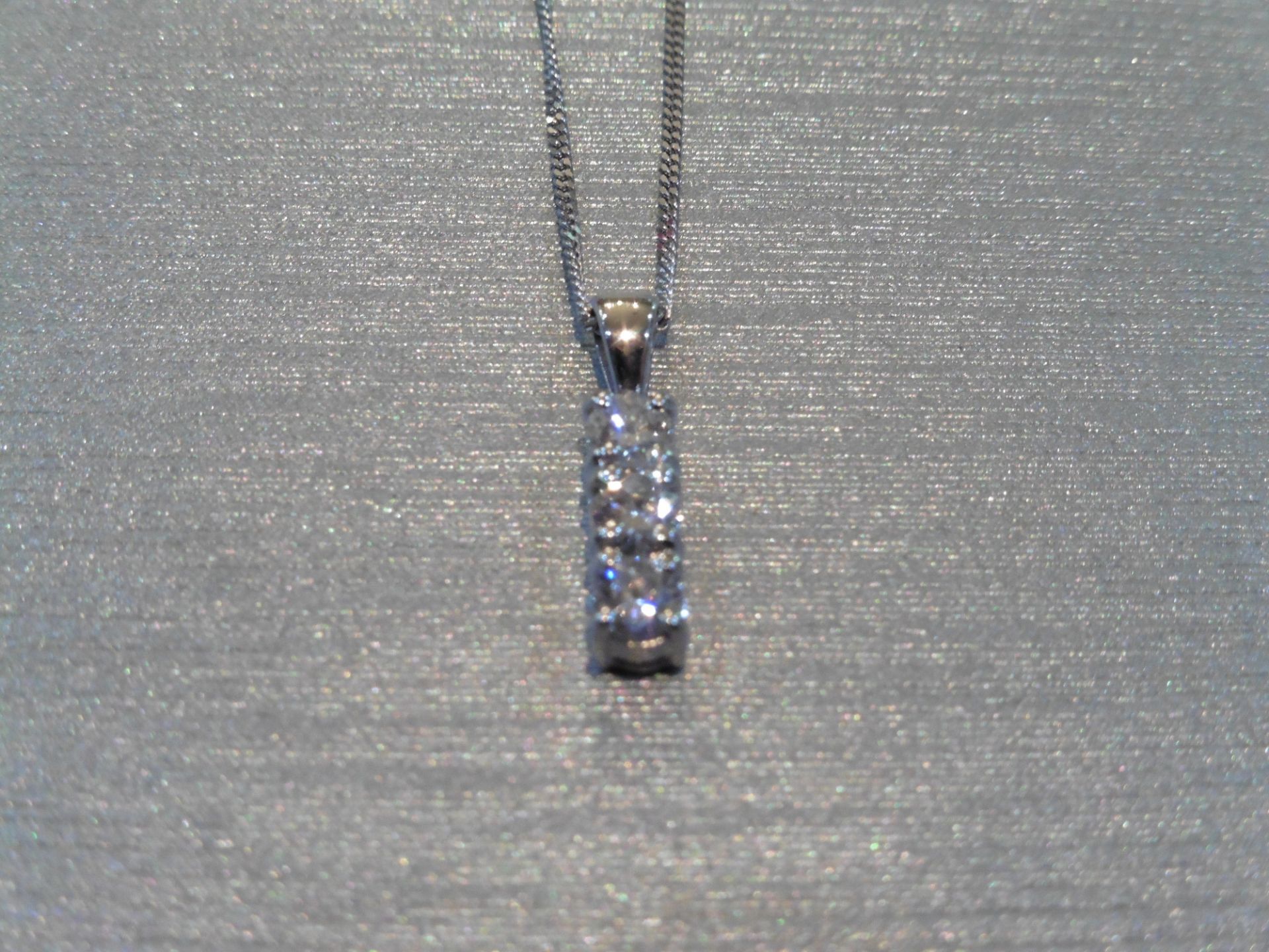 Trilogy pendant set with 3 small brilliant cut diamonds of H/I colour weighing a total of 0.60ct. - Image 2 of 3