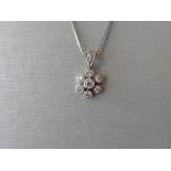 Diamond cluster pendant. Set with a 3mm brilliant cut diamond in the centre which is surrounded with