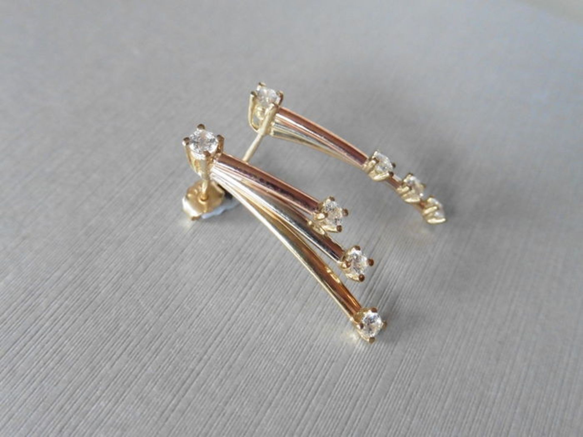 9ct gold diamond set drop style earrings. Set with white, rose and yellow gold bars with a small