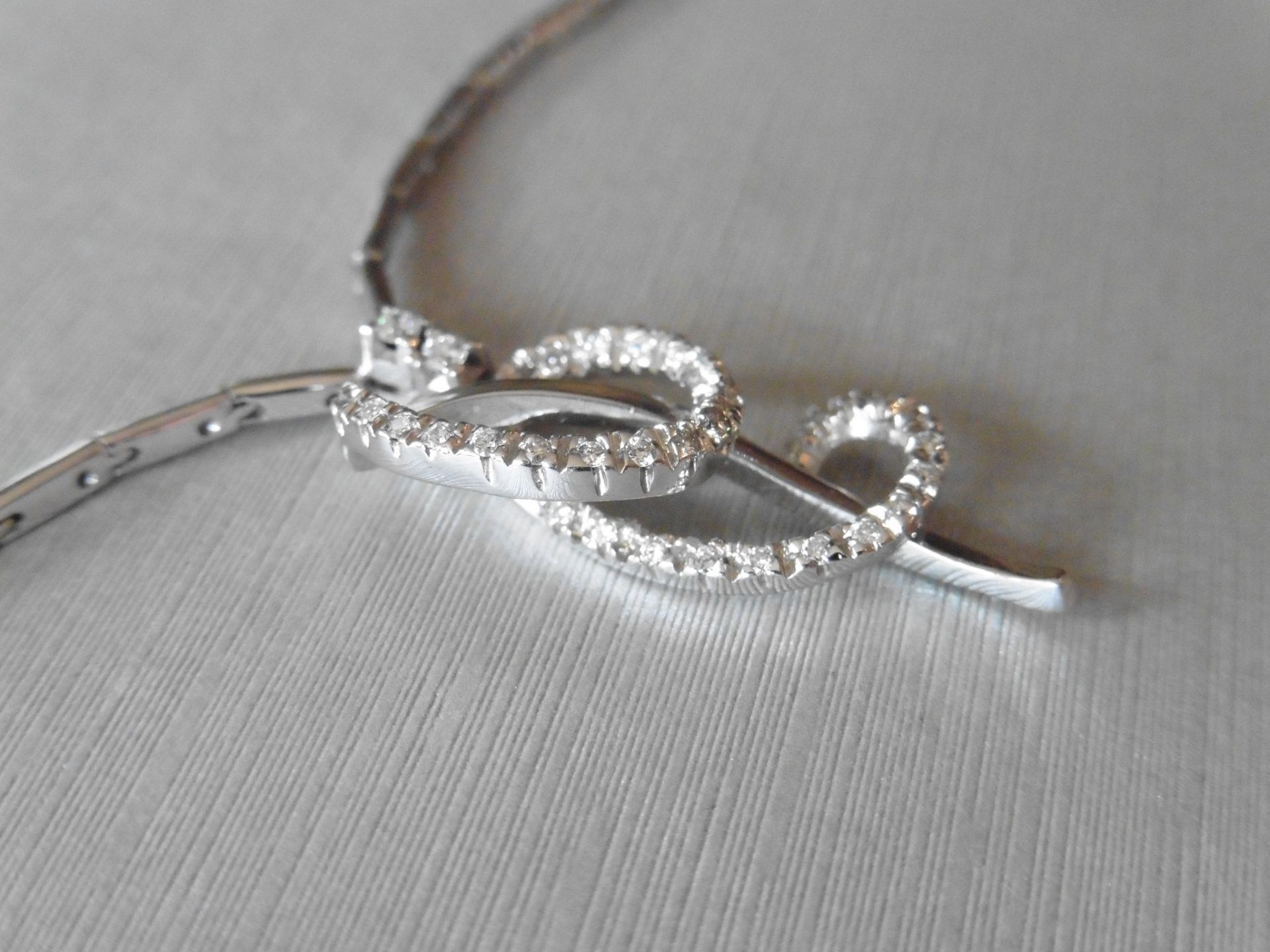 18ct white gold fancy diamond set pendant. Swirl design with small brilliant cut diamonds, H colour, - Image 2 of 6