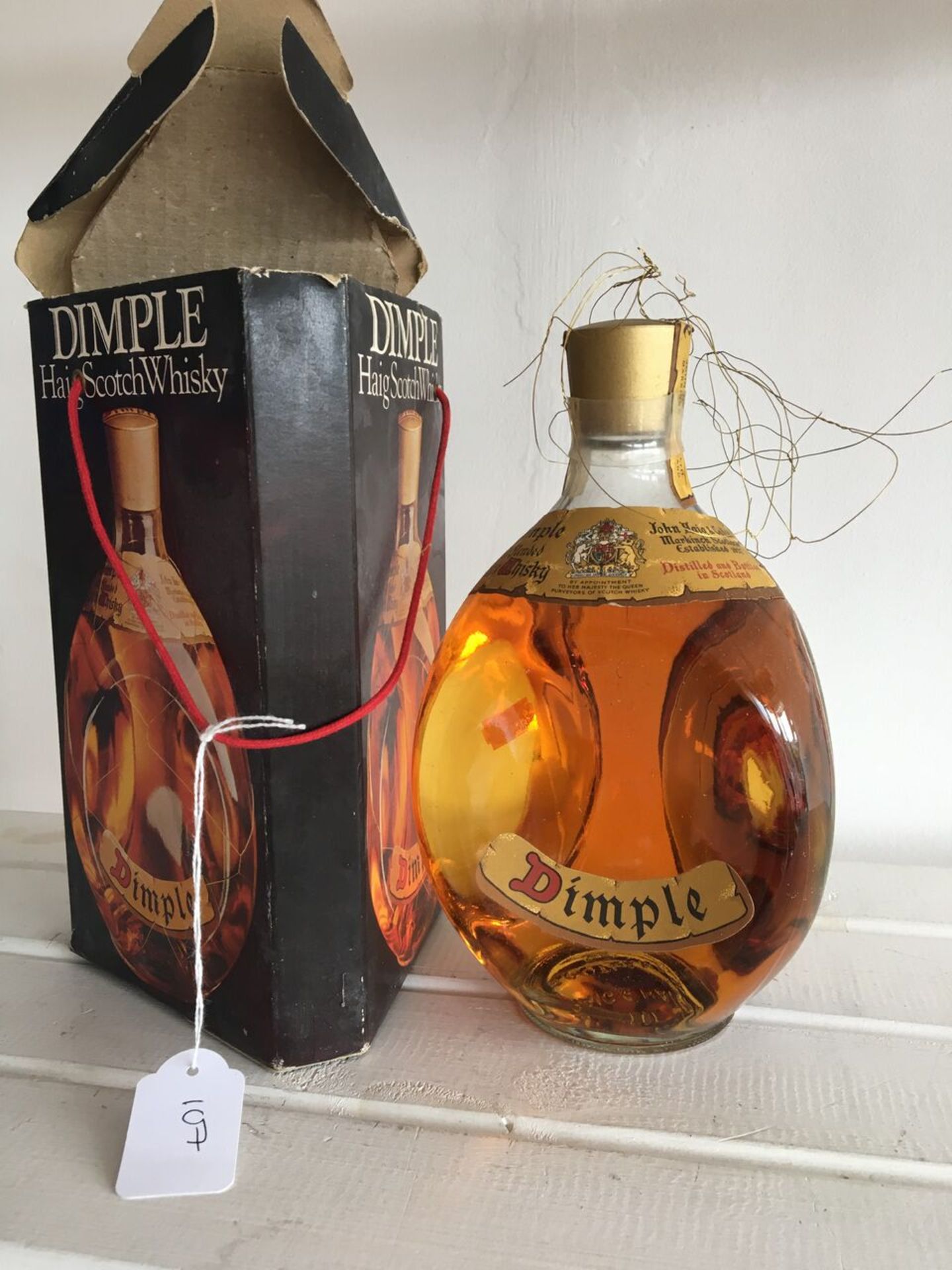 1960S OR 1970S DIMPLE HAIG SCOTCH WHISKY BOTTLE WITH WIRE MESH, ORIGINAL PRESENTATION BOX AND