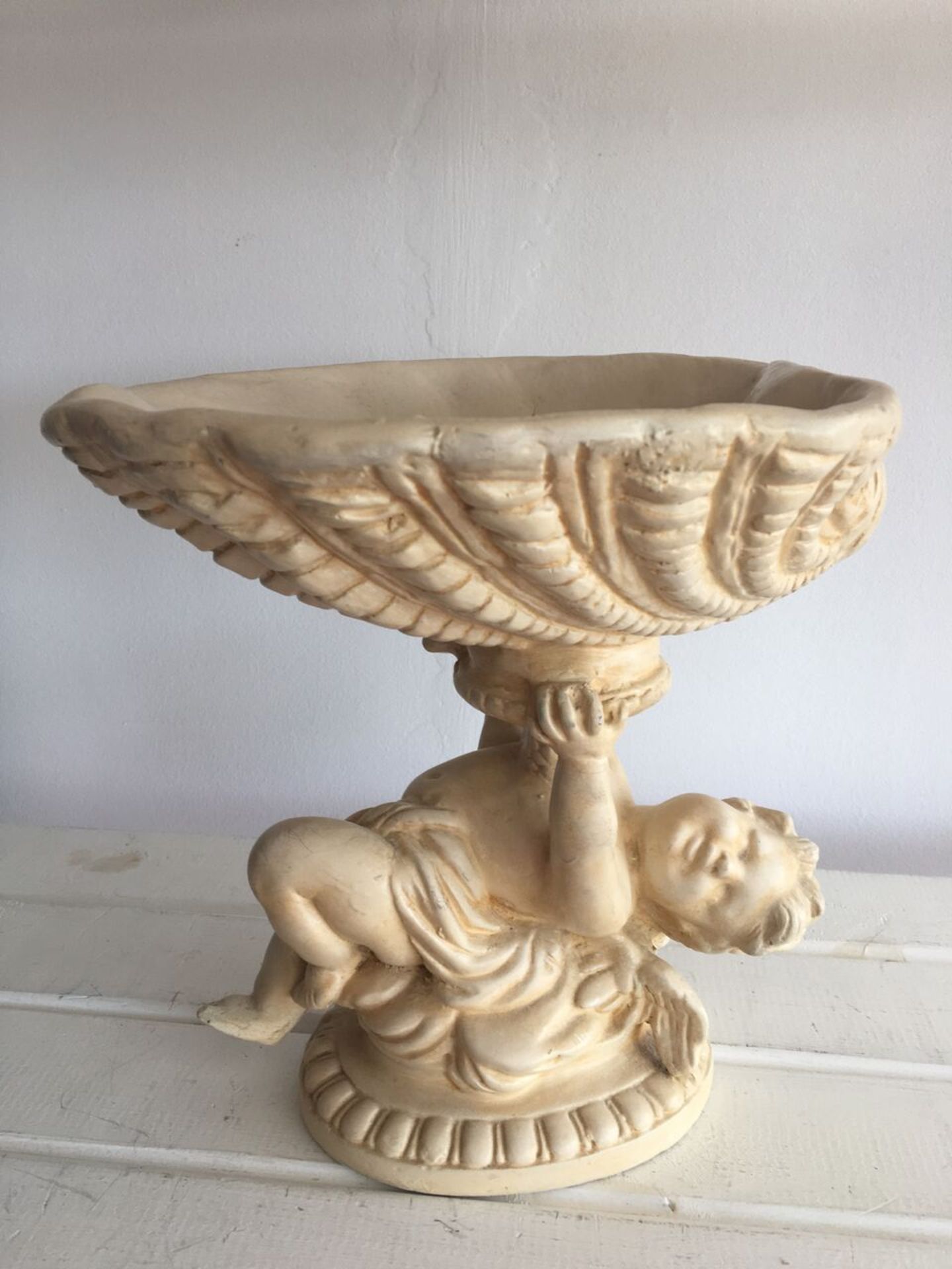 LARGE PLASTER FIGURE OF A CHERUB HOLDING UP A SHELL. 25CM HIGH. FREE UK DELIVERY. NO VAT.