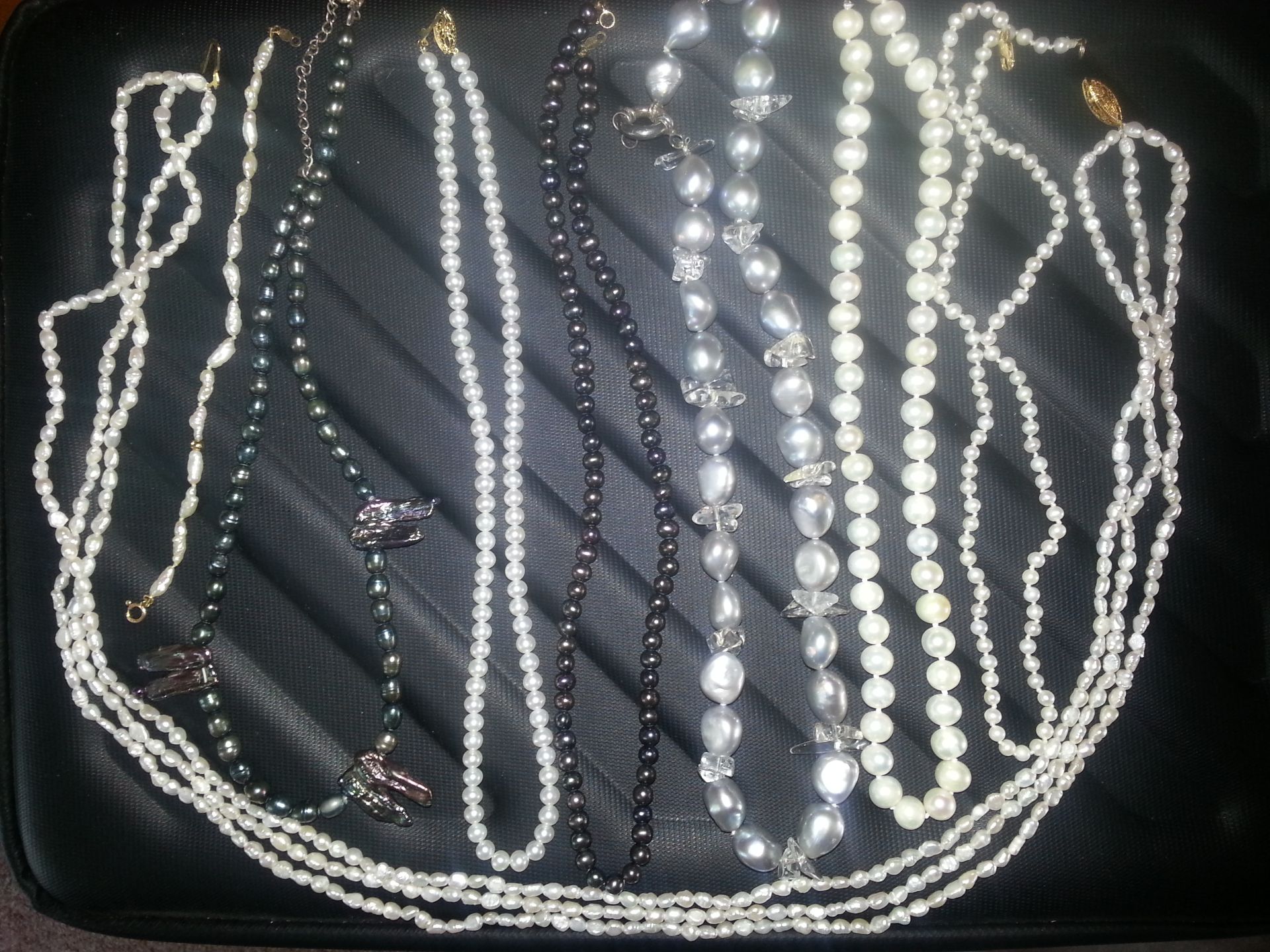 A collection of pearls necklaces and bracelet with 9ct, 14ct and silver etc, clasps