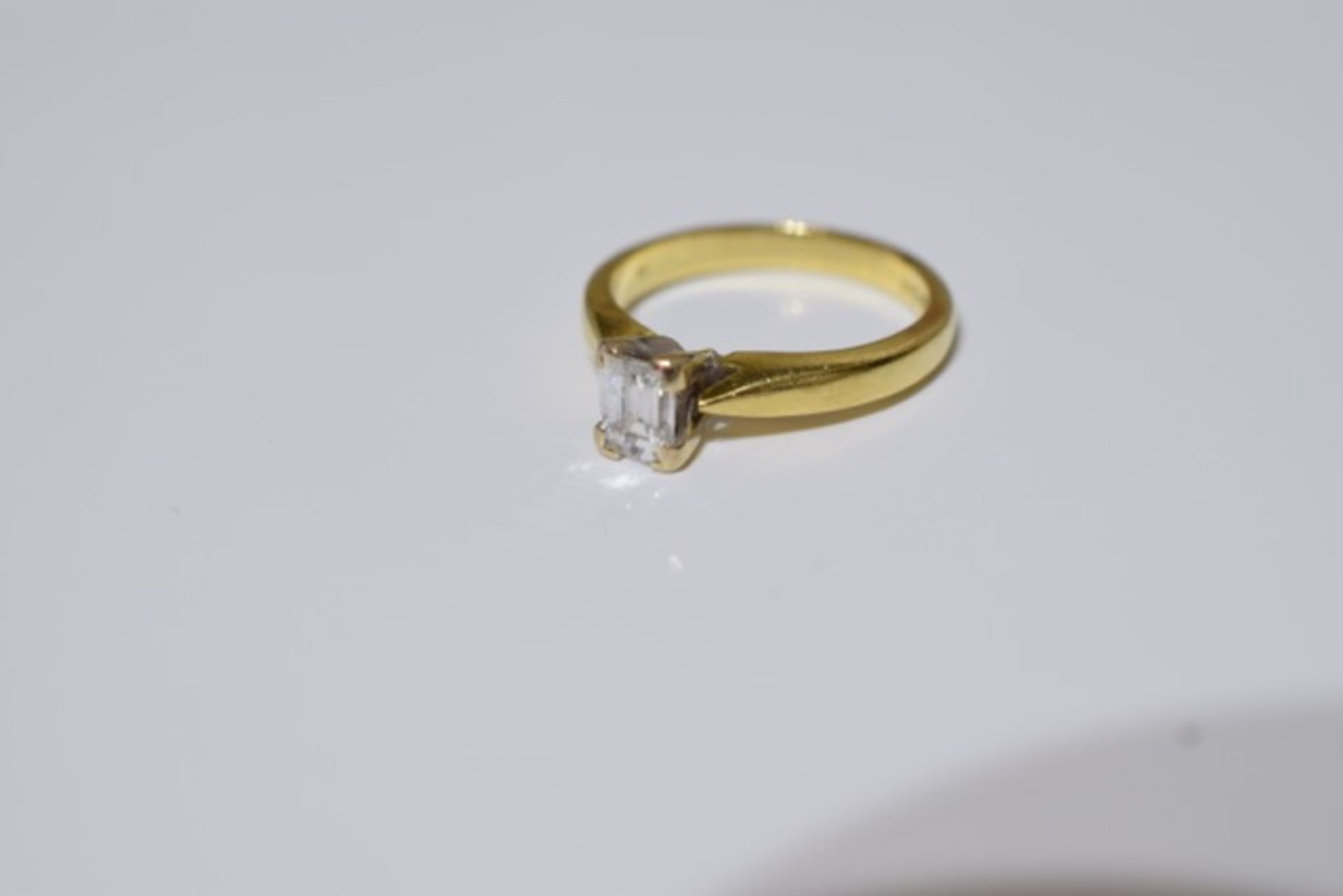 18ct Gold Emerald cut diamond ring, Size J, Clear without inclusions visible to the eye.