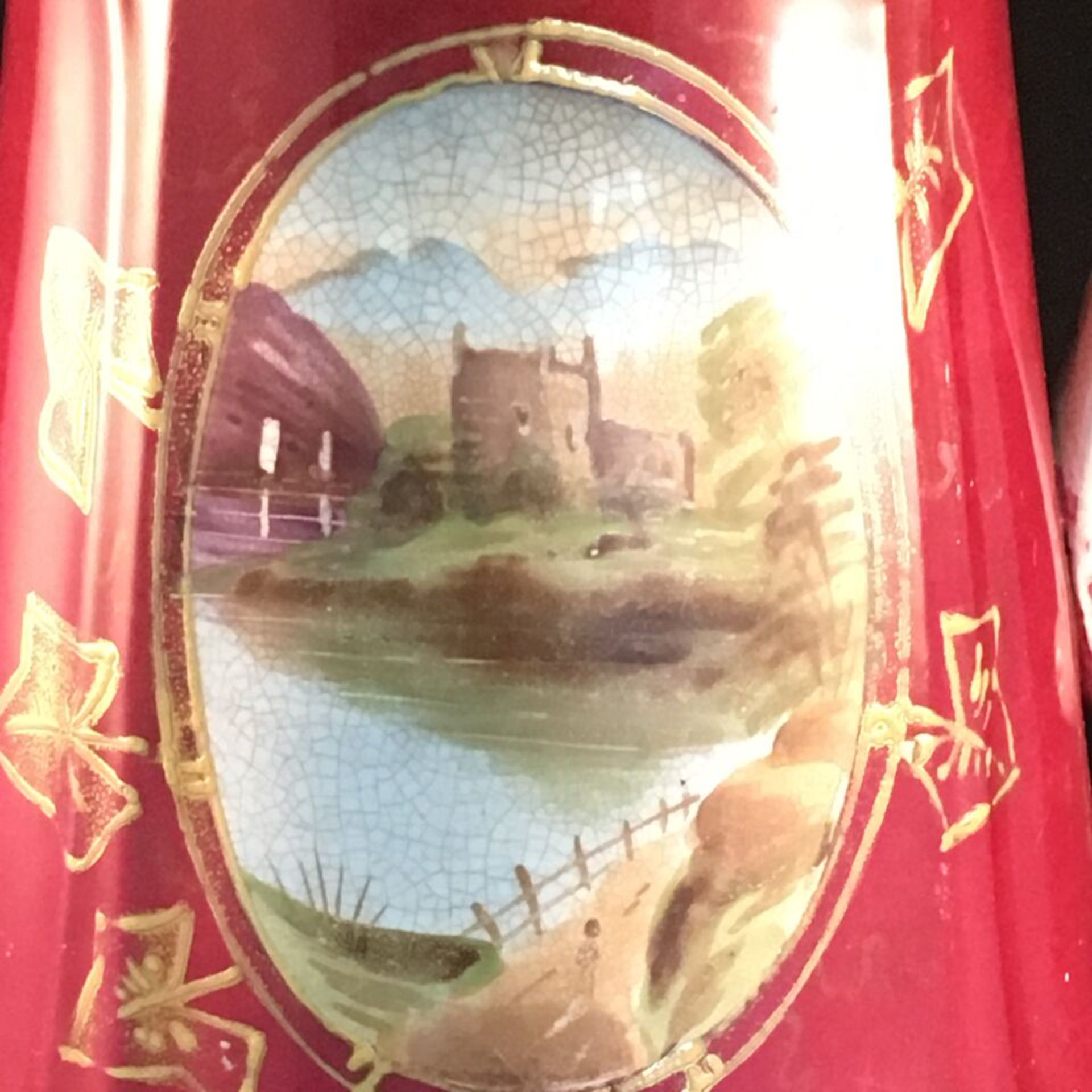 ANTIQUE LARGE VICTORIAN JUG A large Victorian jug in red with hand painted landscape scene. Has