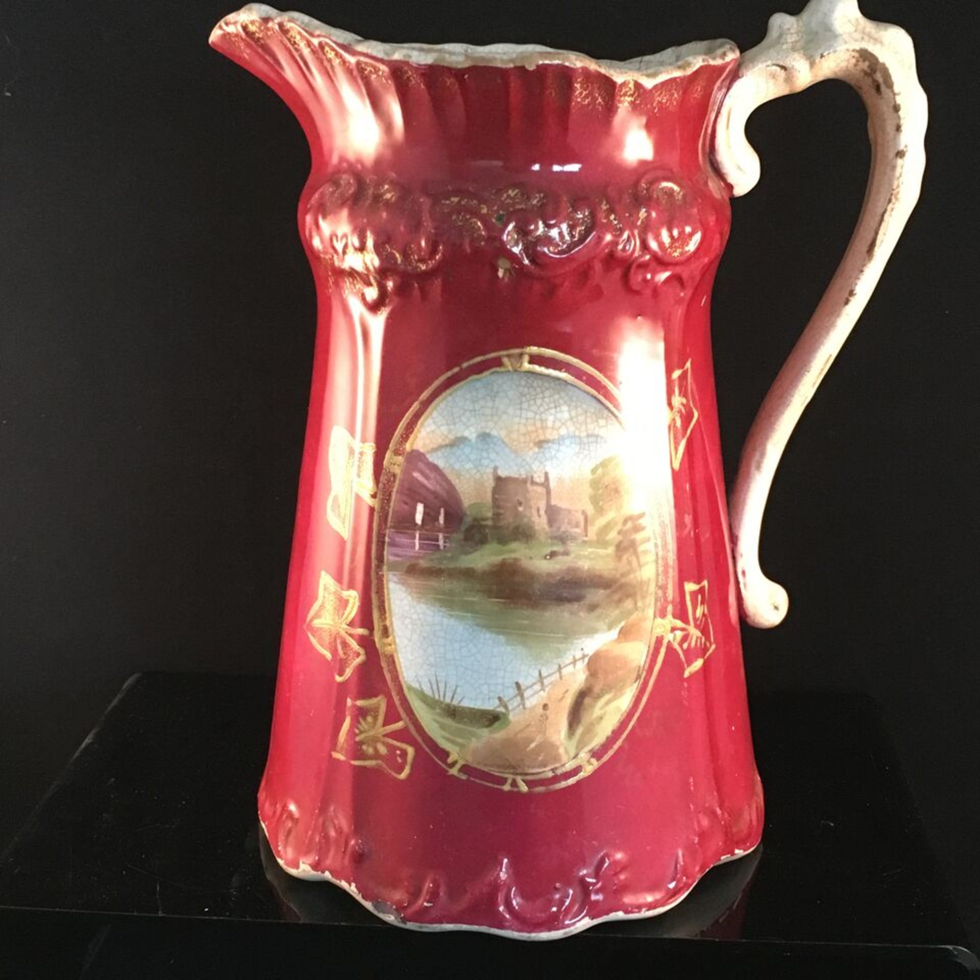 ANTIQUE LARGE VICTORIAN JUG A large Victorian jug in red with hand painted landscape scene. Has - Image 2 of 2
