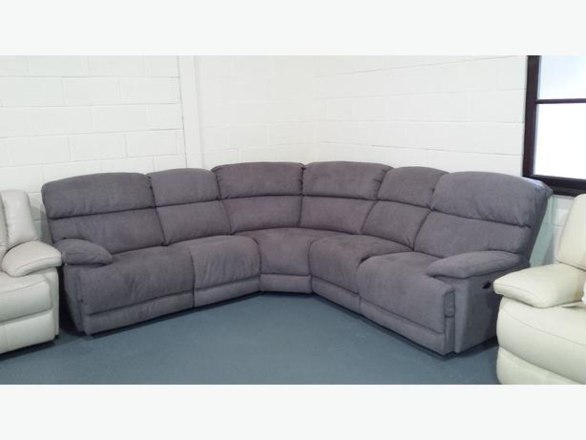 Brand new direct from the manufacturers supreme valance reclining corner sofa in light grey fabric
