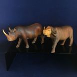 PAIR OF HAND CARVED WOODEN ANIMALS - RHINOCEROS AND BUFFALO. EACH MEASURES APPROX 14CM X 8CM. FREE