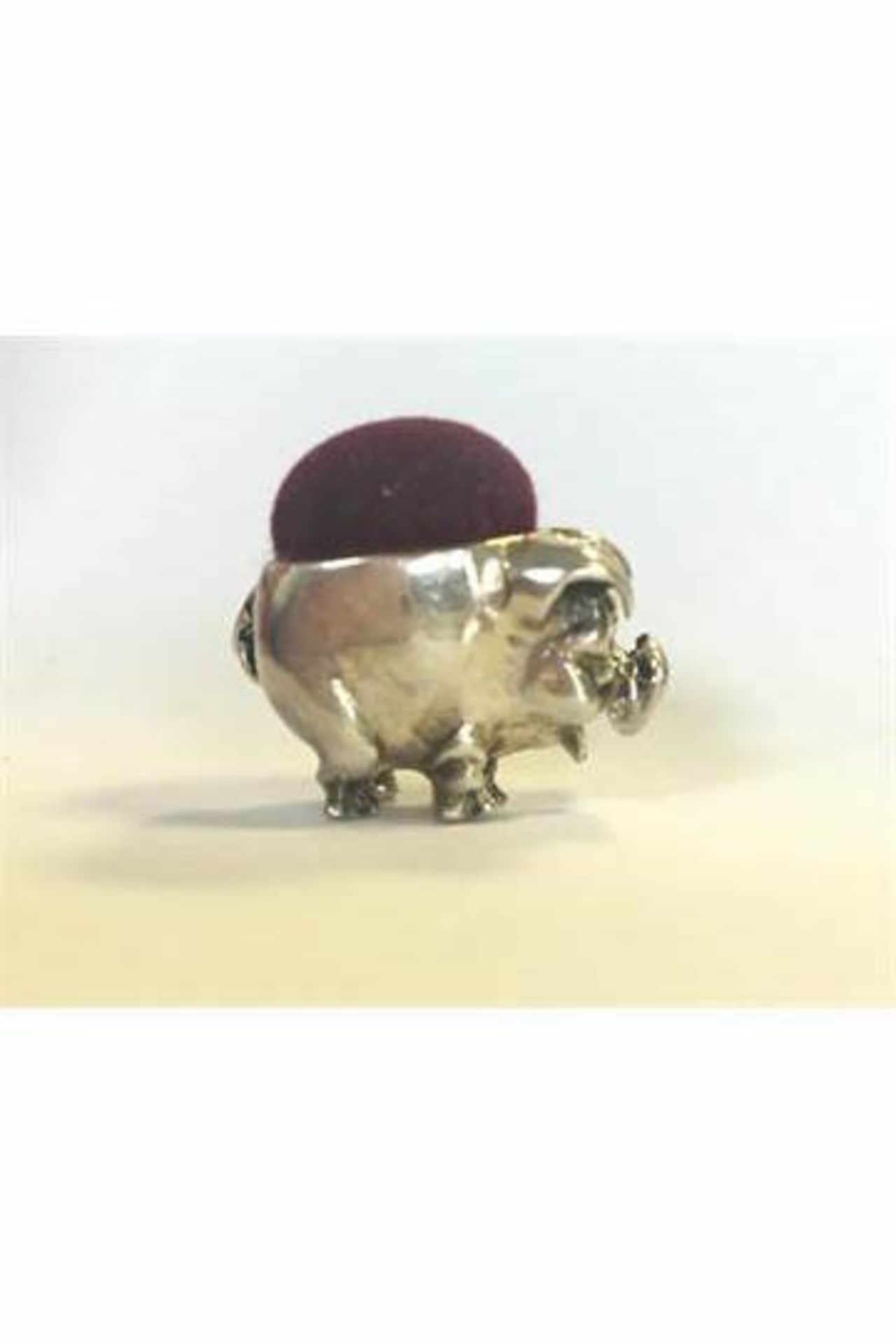 A SILVER (STAMPED 925) MINIATURE PIN CUSHION IN THE FORM OF A PIG. FREE UK DELIVERY.