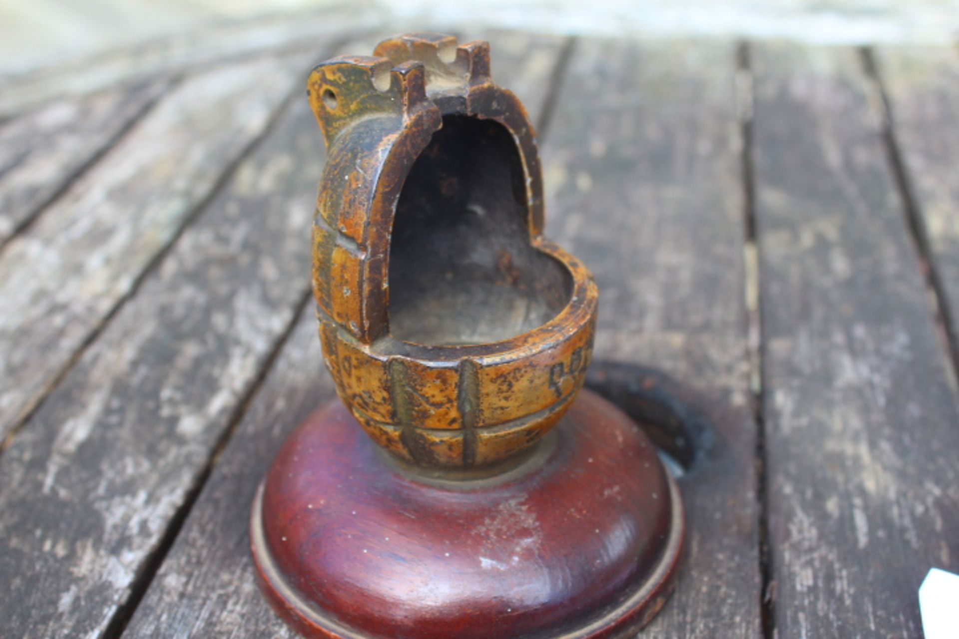 British military trench art. This is a mills grenade mounted on a wooden base.. Can be used as a