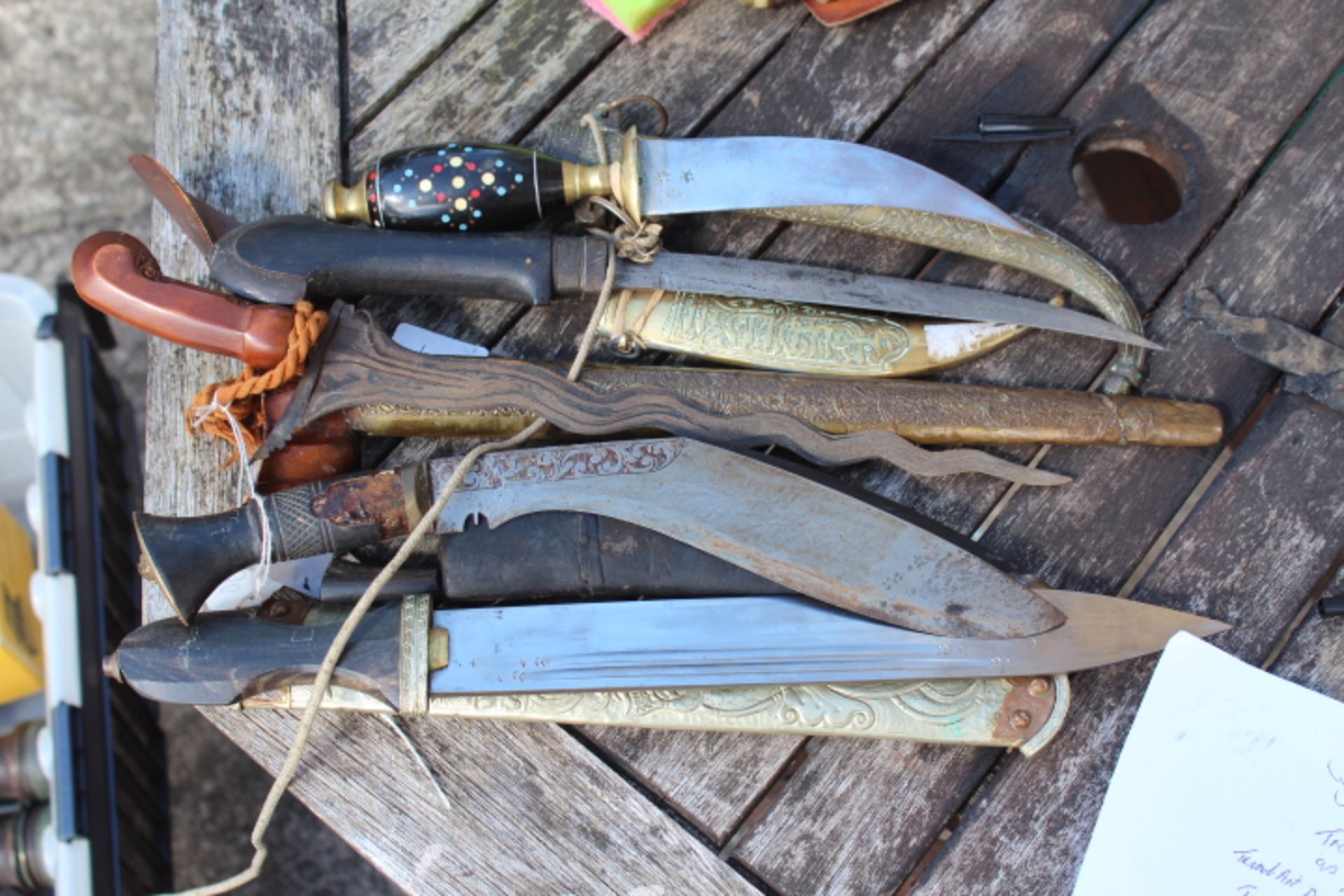 4 Middle Eastten and Asian Daggers. All come with scabbard. Buyer must be 18+.