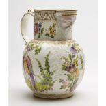 ANTIQUE CABBAGE LEAF MASK JUG WITH EXOTIC BIRDS 18/19TH C.