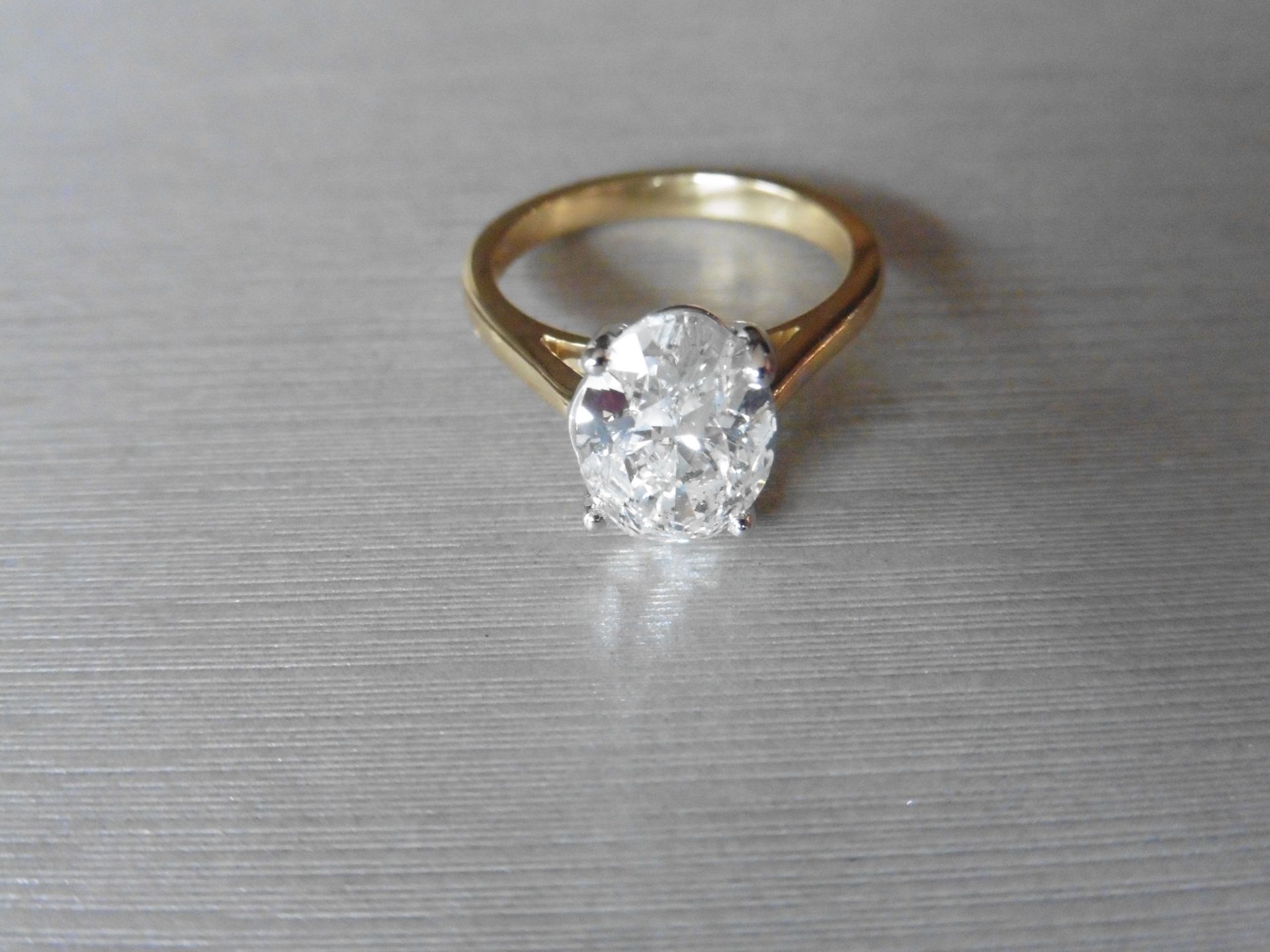 3.01ct oval cut diamond, H colour, Si2 clarity. 18Ct, 4 claw white gold setting with a yellow gold - Image 4 of 4