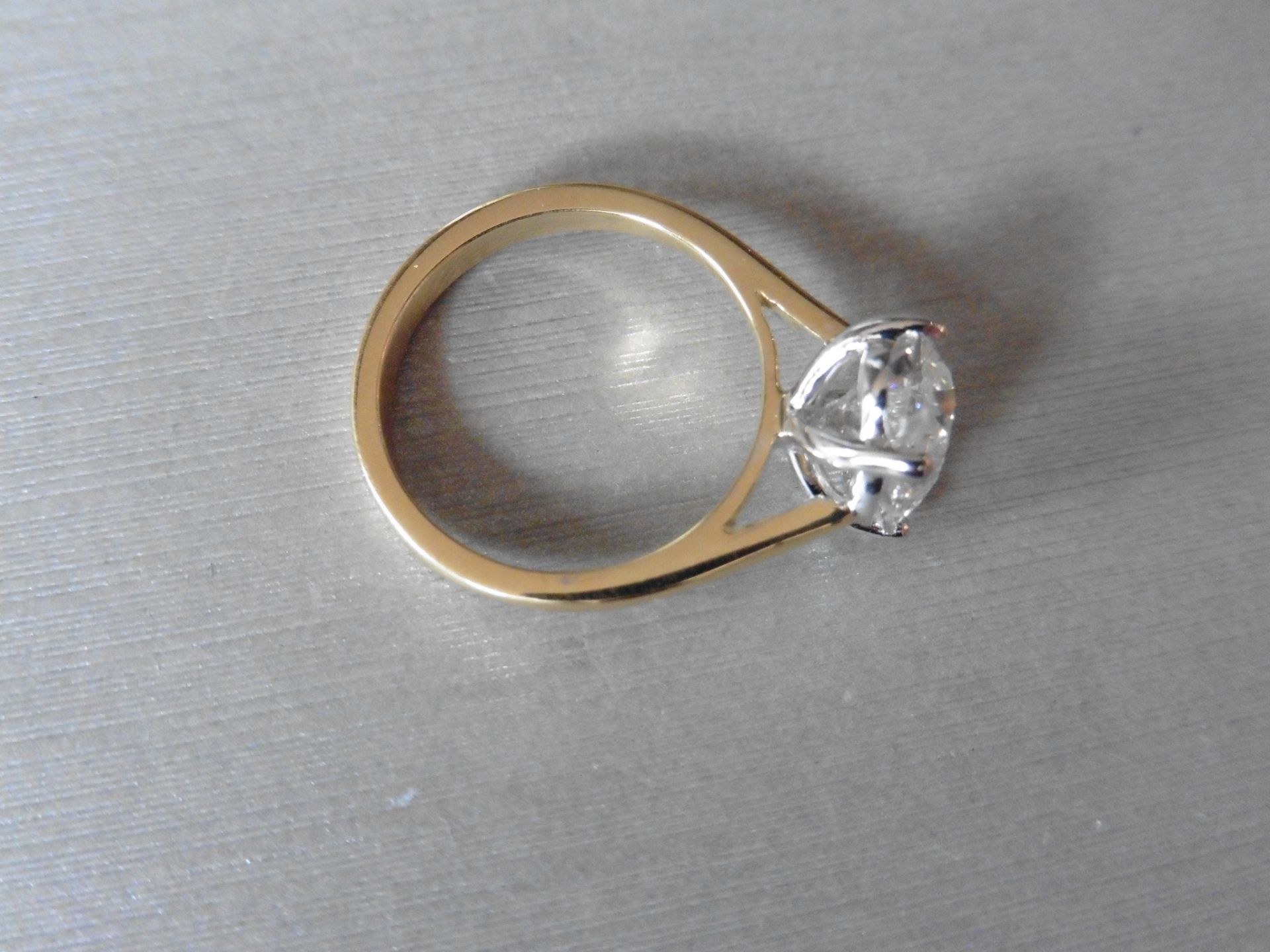 3.01ct oval cut diamond, H colour, Si2 clarity. 18Ct, 4 claw white gold setting with a yellow gold - Image 3 of 4