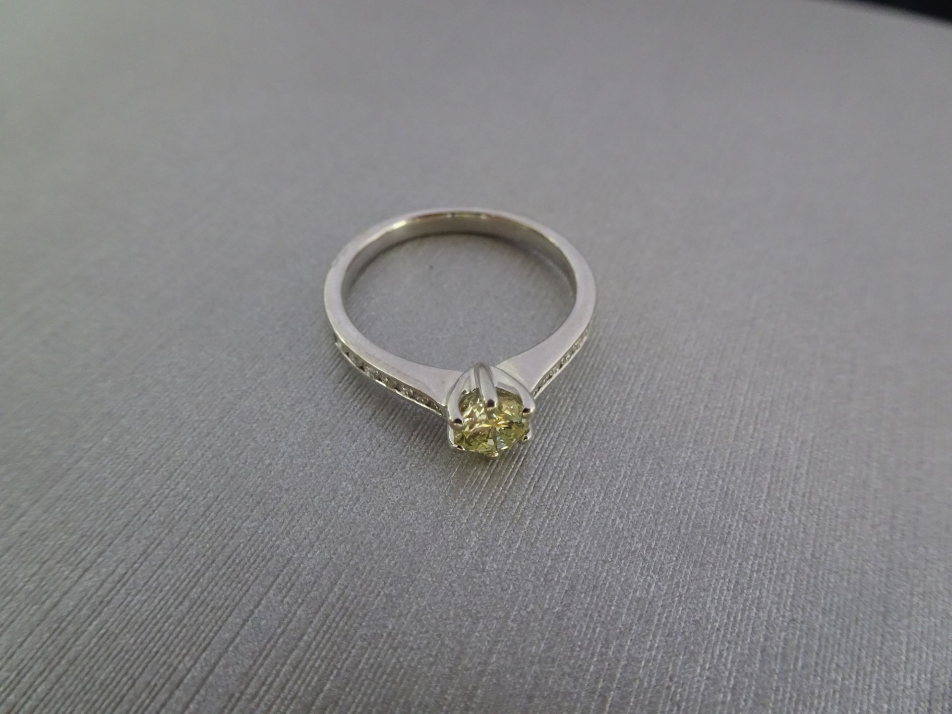 0.40ct Diamond set solitaire ring with a brilliant cut yellow diamond in the centre. The shoulders - Image 3 of 3