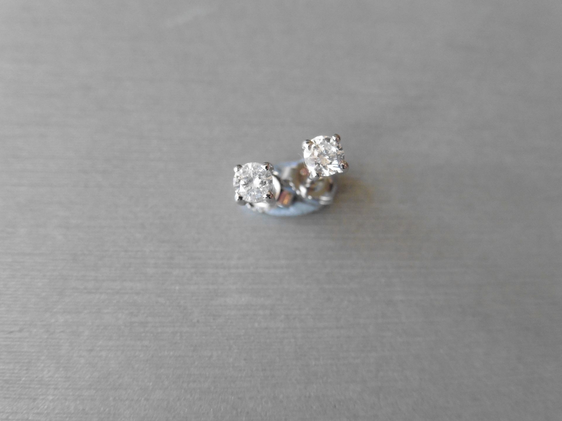 0.45ct Solitaire diamond stud earrings set with brilliant cut diamonds, SI3 clarity and H/I