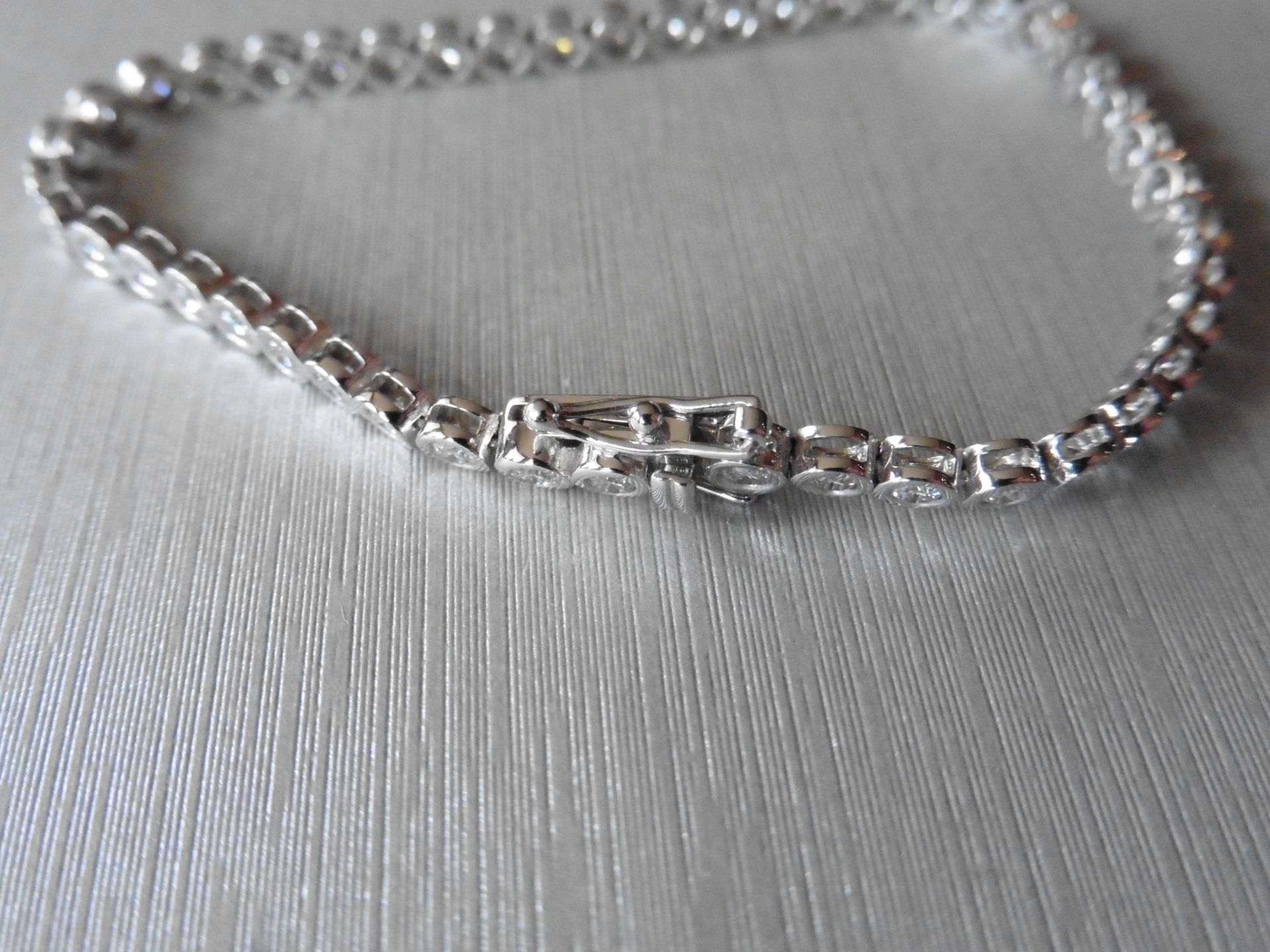 3.50ct tennis style bracelet set with brilliant cut diamonds. I colour, Si3 clarity. 18Ct white - Image 2 of 3