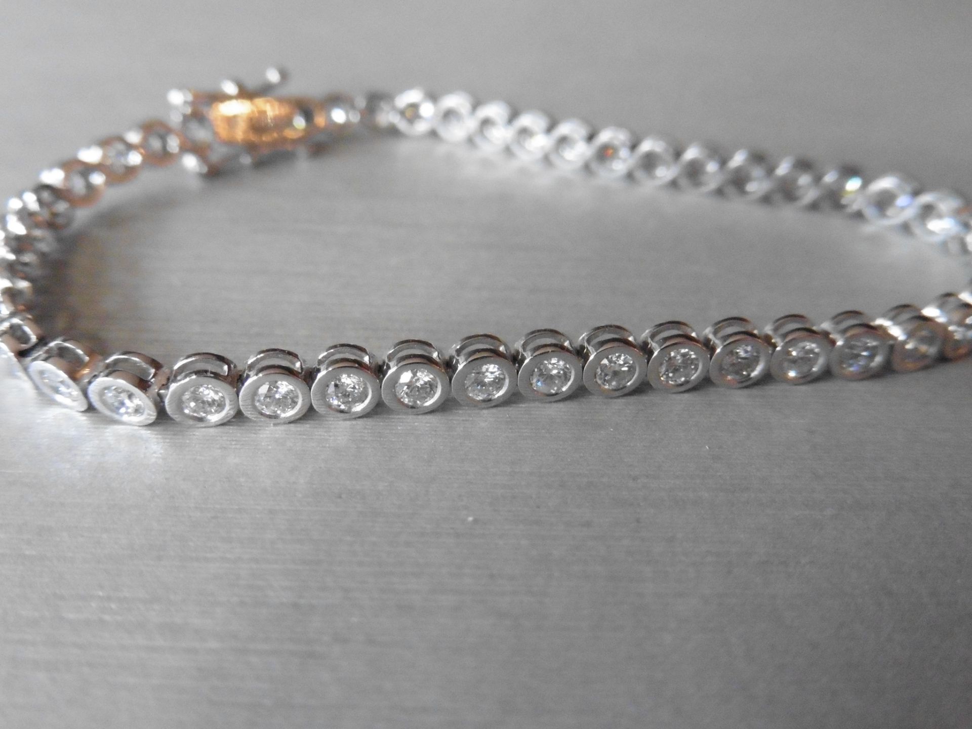 3.50ct tennis style bracelet set with brilliant cut diamonds. I colour, Si3 clarity. 18Ct white