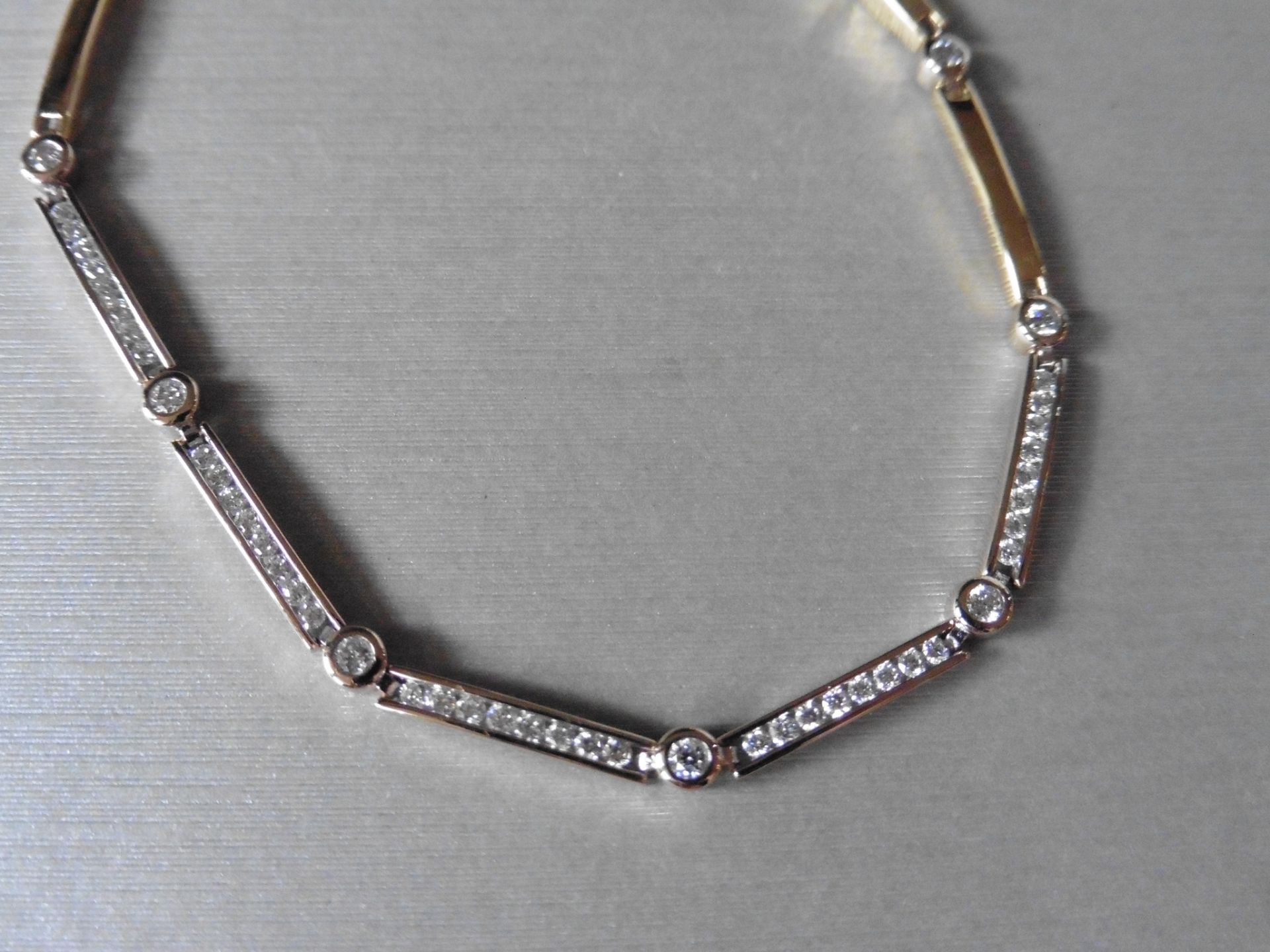 18ct gold fancy diamond bracelet. Set in white gold with yellow gold sections. Diamonds are H/I
