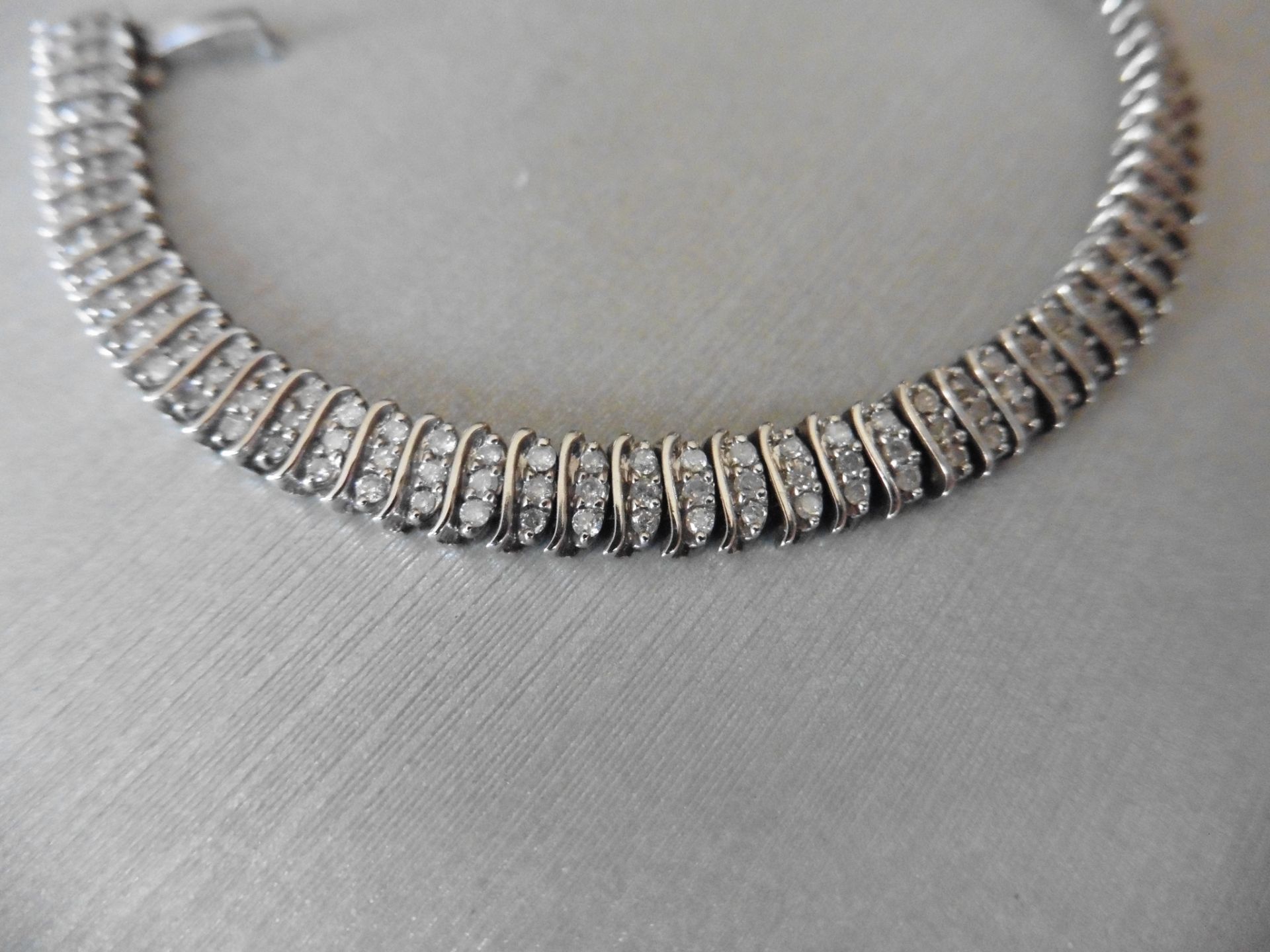 2.02ct 9ct white gold fancy diamond bracelet. Set with 3 rows of small brilliant cut diamonds, I - Image 2 of 5