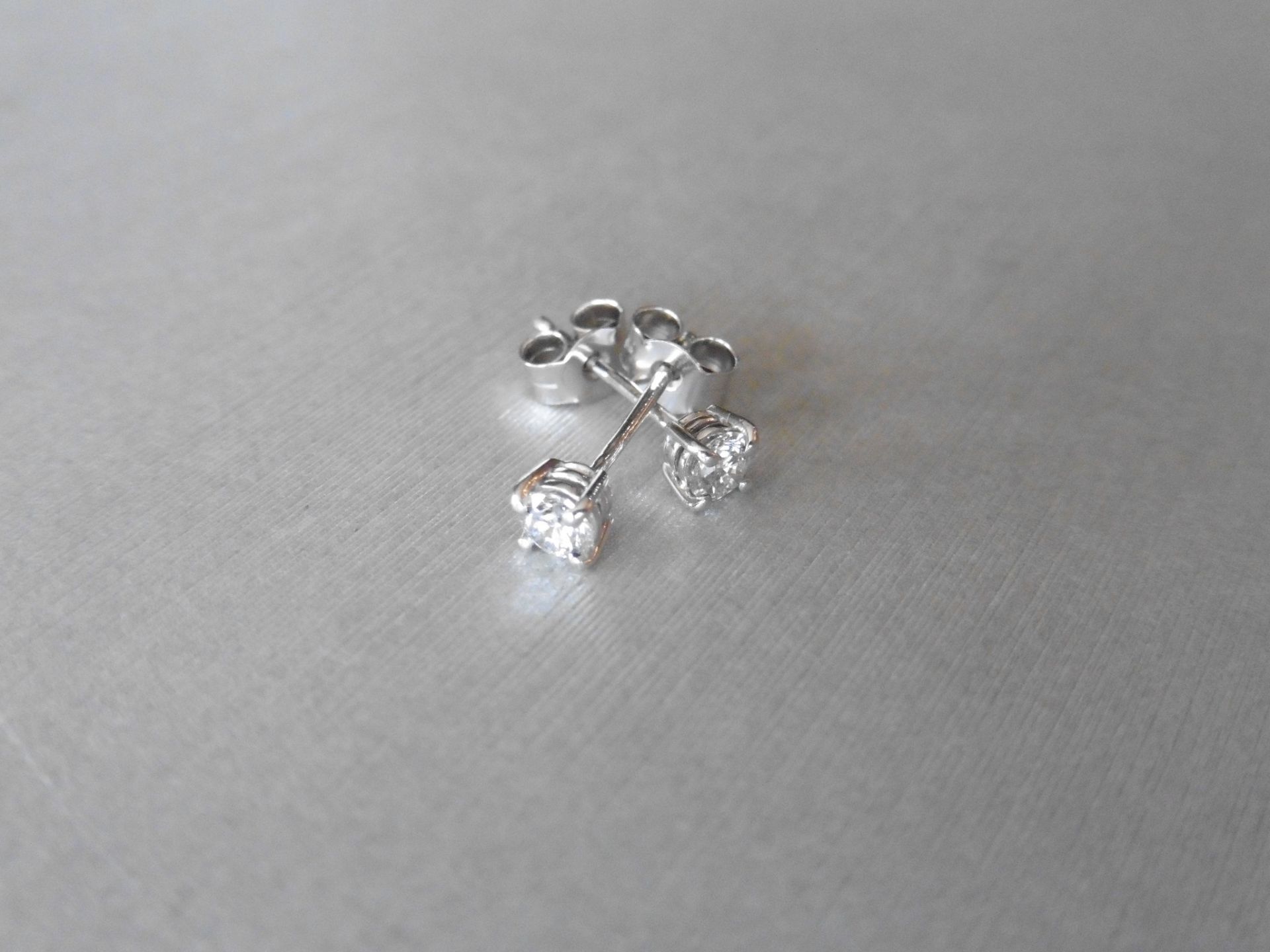 0.50ct Solitaire diamond stud earrings set with brilliant cut diamonds, SI3 clarity and H/Icolour.