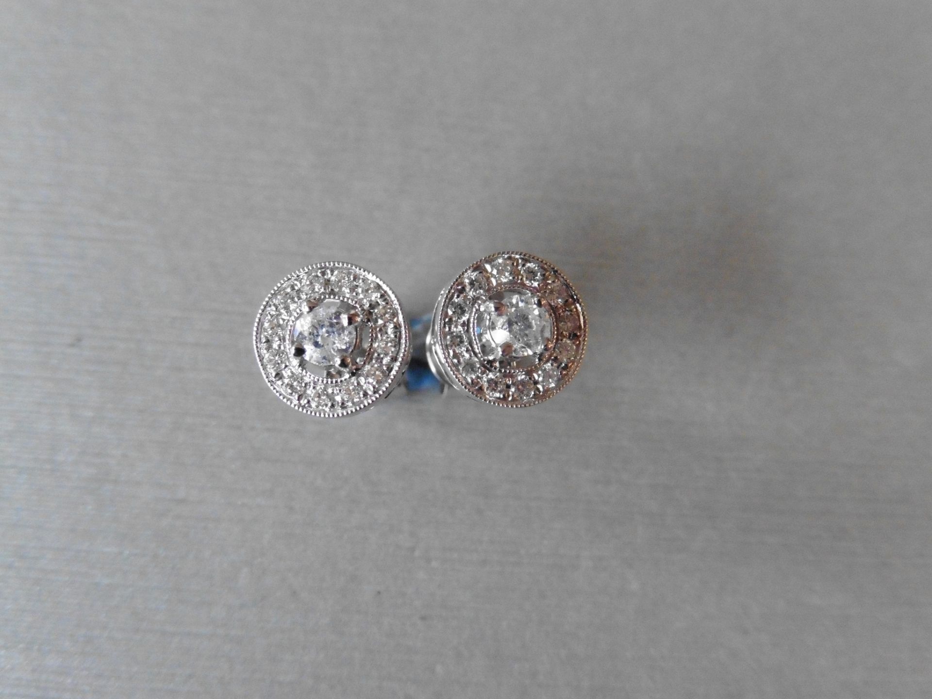 0.32ct diamond set stud earrings set in 18ct gold. Set with brilliant cut diamonds,