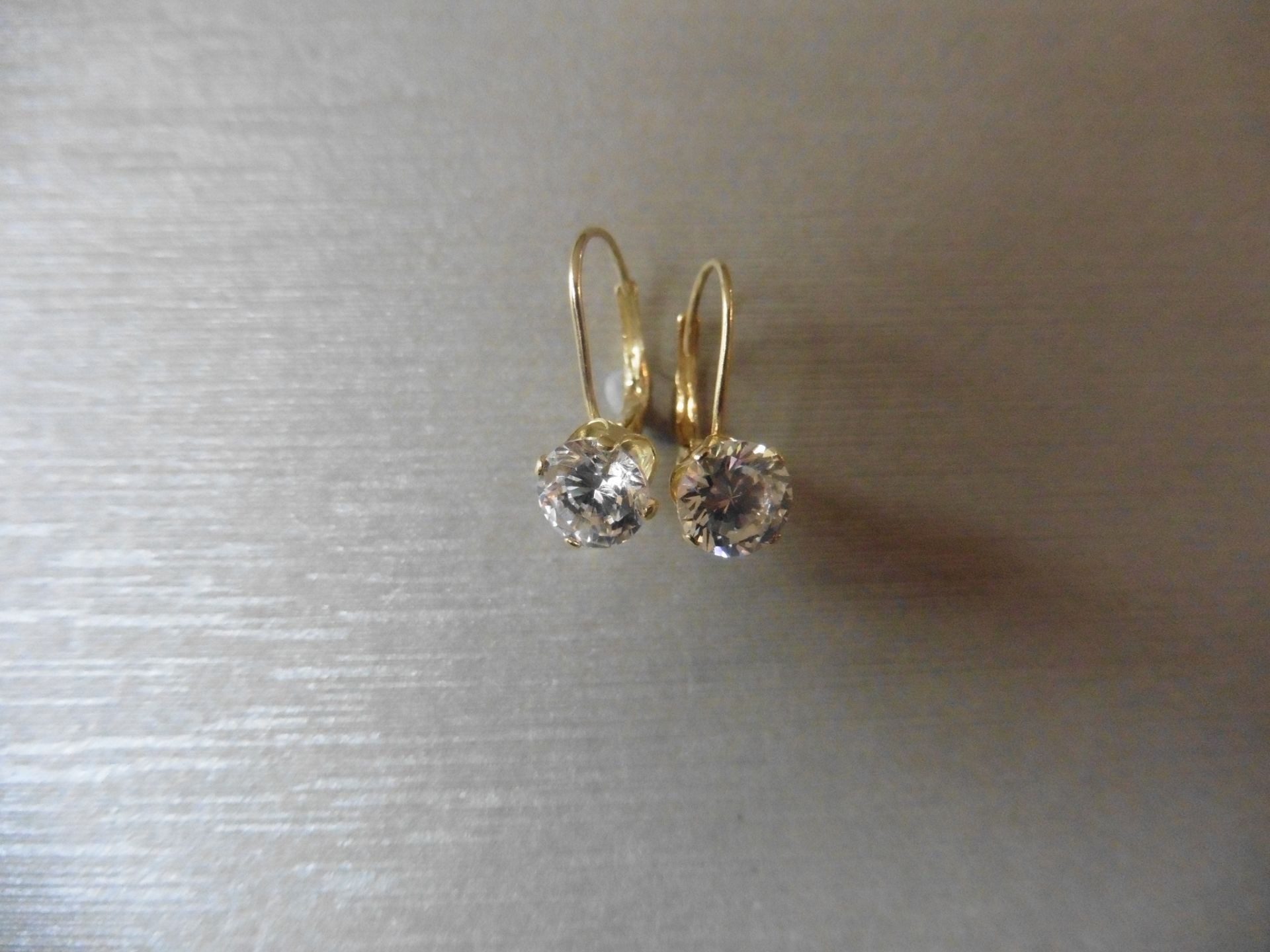 0.80ct diamond hinged style earrings each set with a brilliant cut diamond, I colour,Si2 clarity.