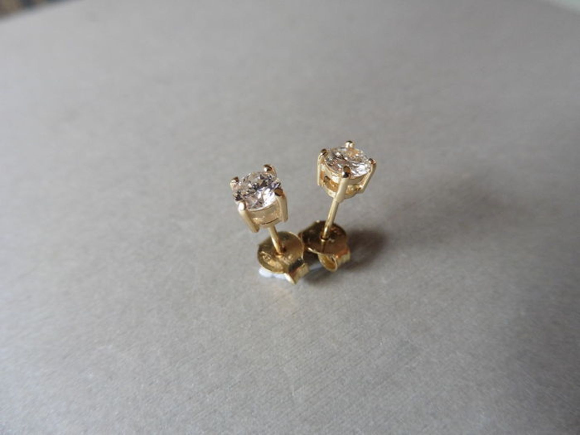 0.60ct Solitaire diamond stud earrings set with brilliant cut diamonds, SI2 clarity and I colour.
