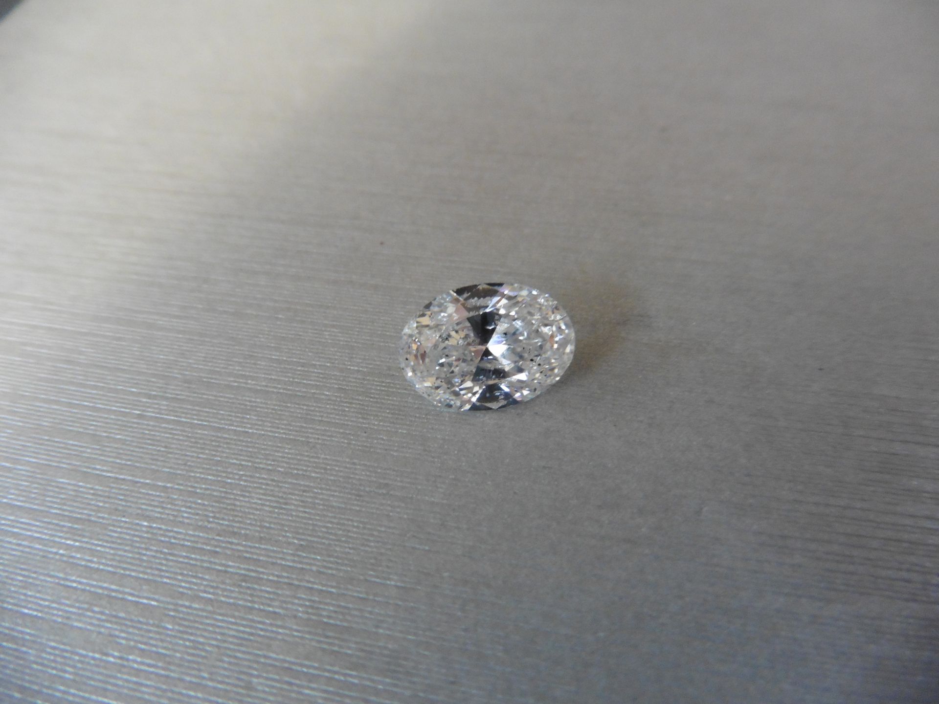 3.37ct loose oval cut diamond, E colour SI3 clarity. Ideal for ring mounting. Valued at £44000