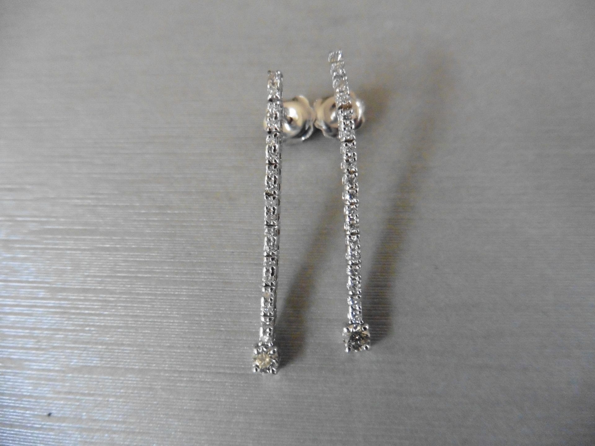 18ct white gold diamond drop earrings set with brilliant cut diamonds. I colour, si2 clarity.