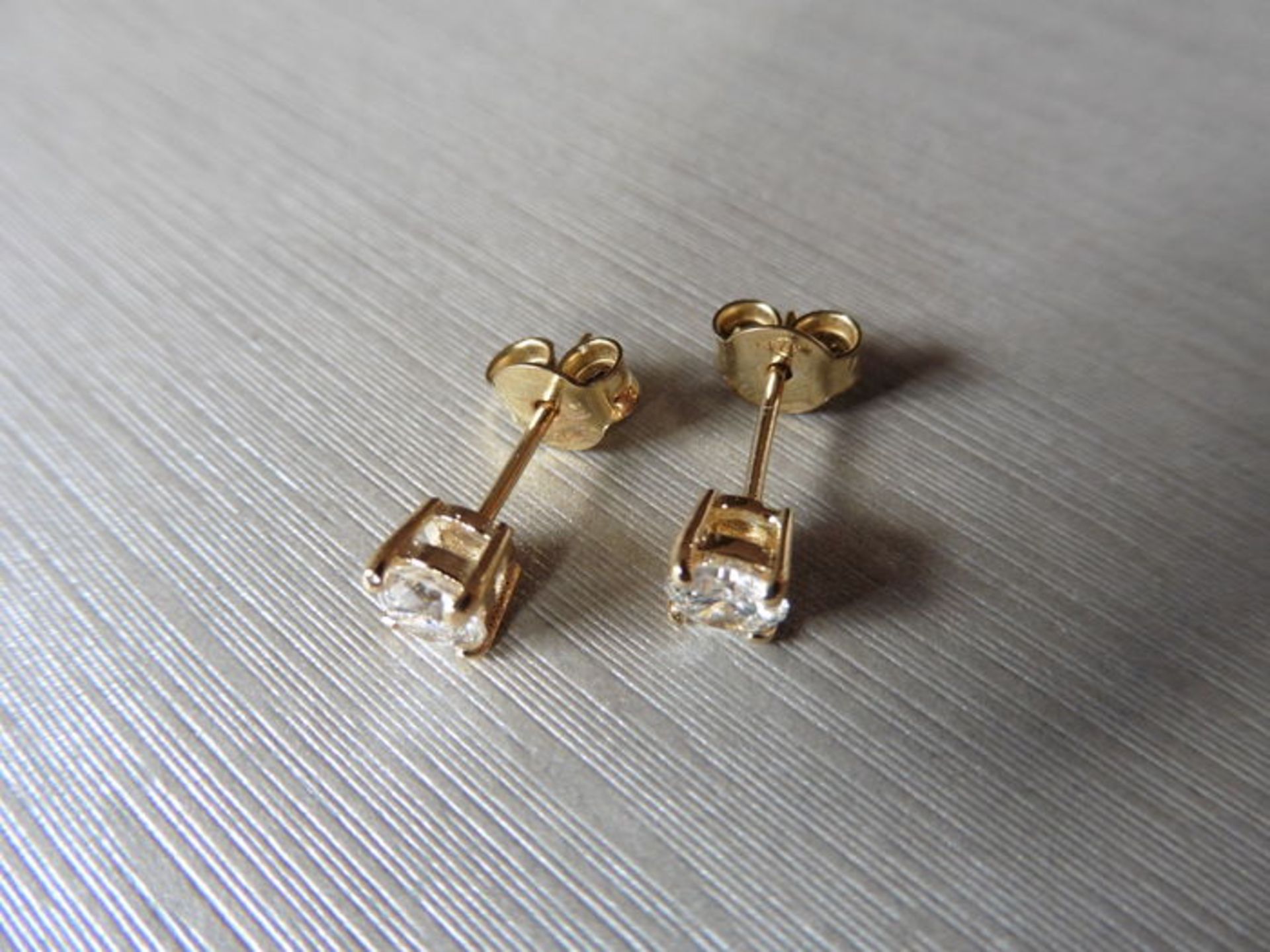 0.60ct Solitaire diamond stud earrings set with brilliant cut diamonds, SI2 clarity and I colour. - Bild 2 aus 2