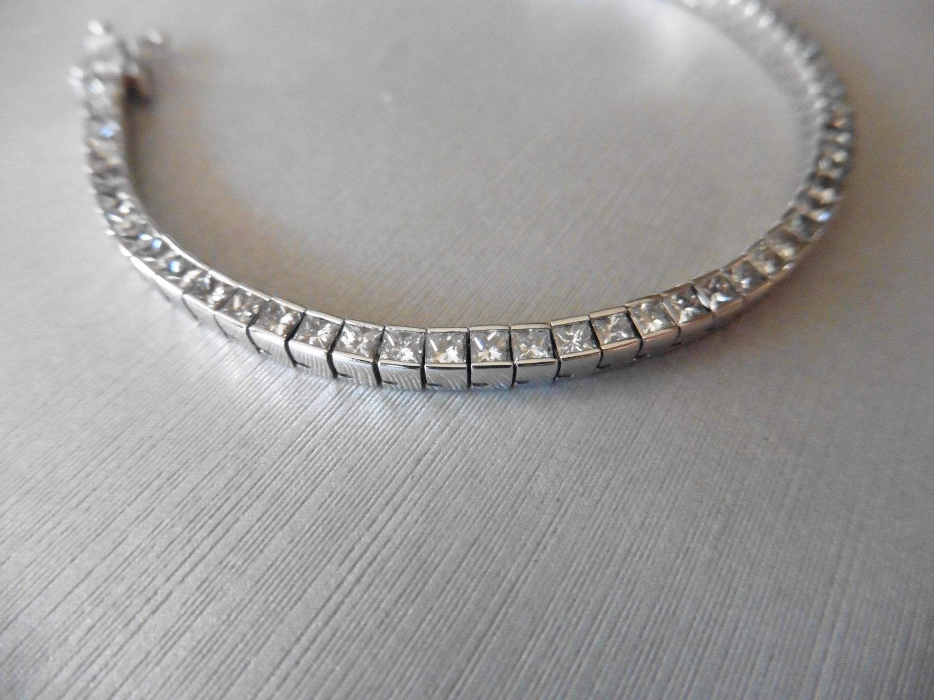 4.93ct 18ct white gold diamond tennis style bracelet set with princess cut diamonds, I/J colour. Rub - Image 2 of 4