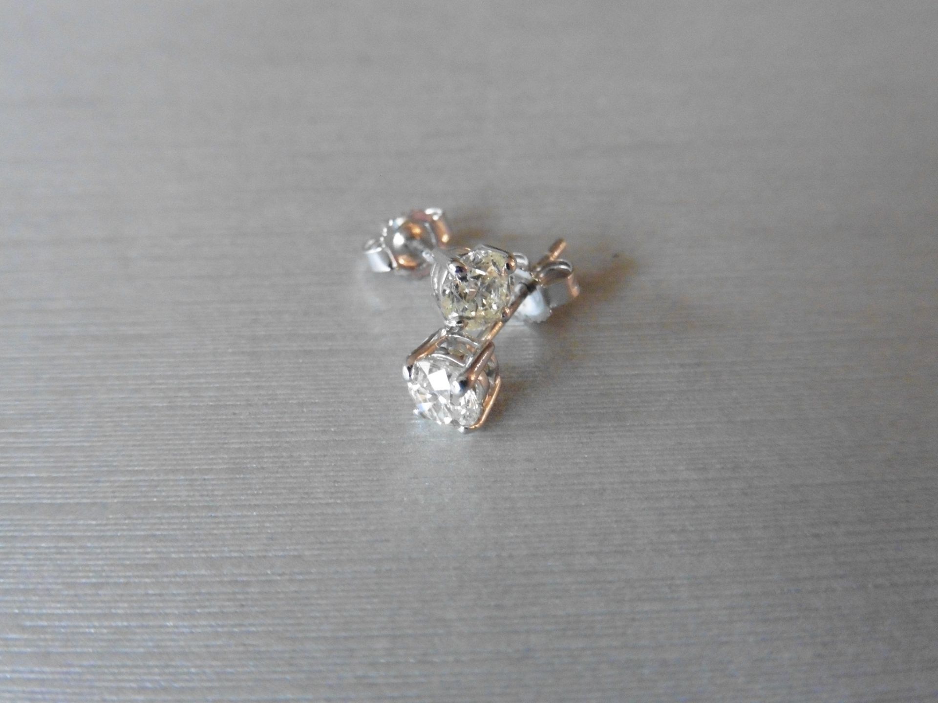 0.60ct Solitaire diamond stud earrings set with brilliant cut diamonds, SI3 clarity and I colour.