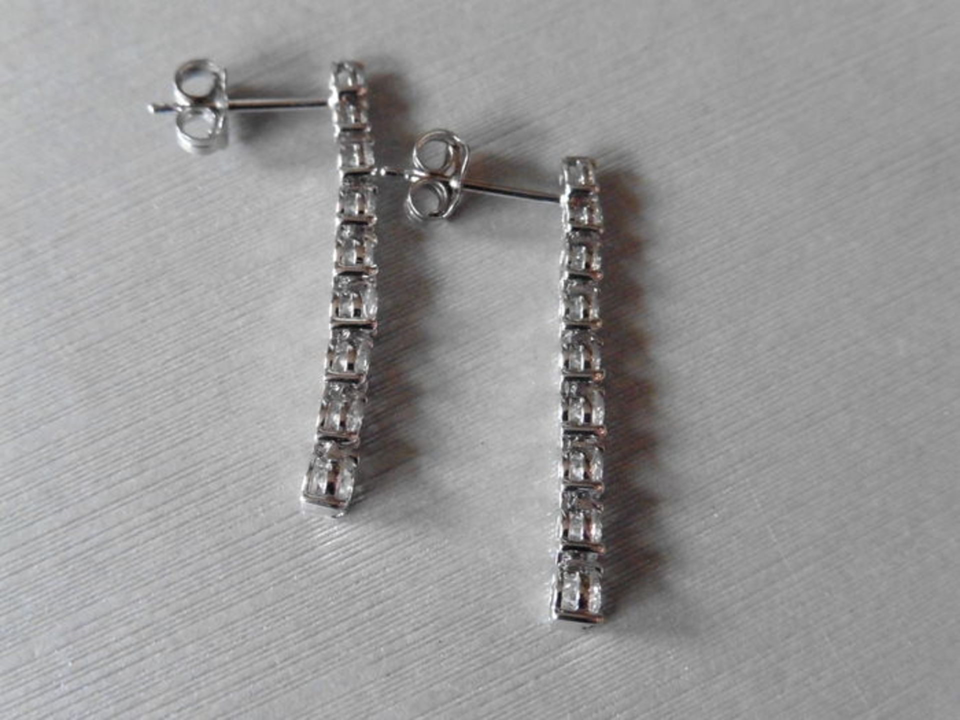 1.50ct graduated diamond drop earrings. Graduated brilliant cut diamonds, I colour weighing 1.50ct - Image 2 of 4