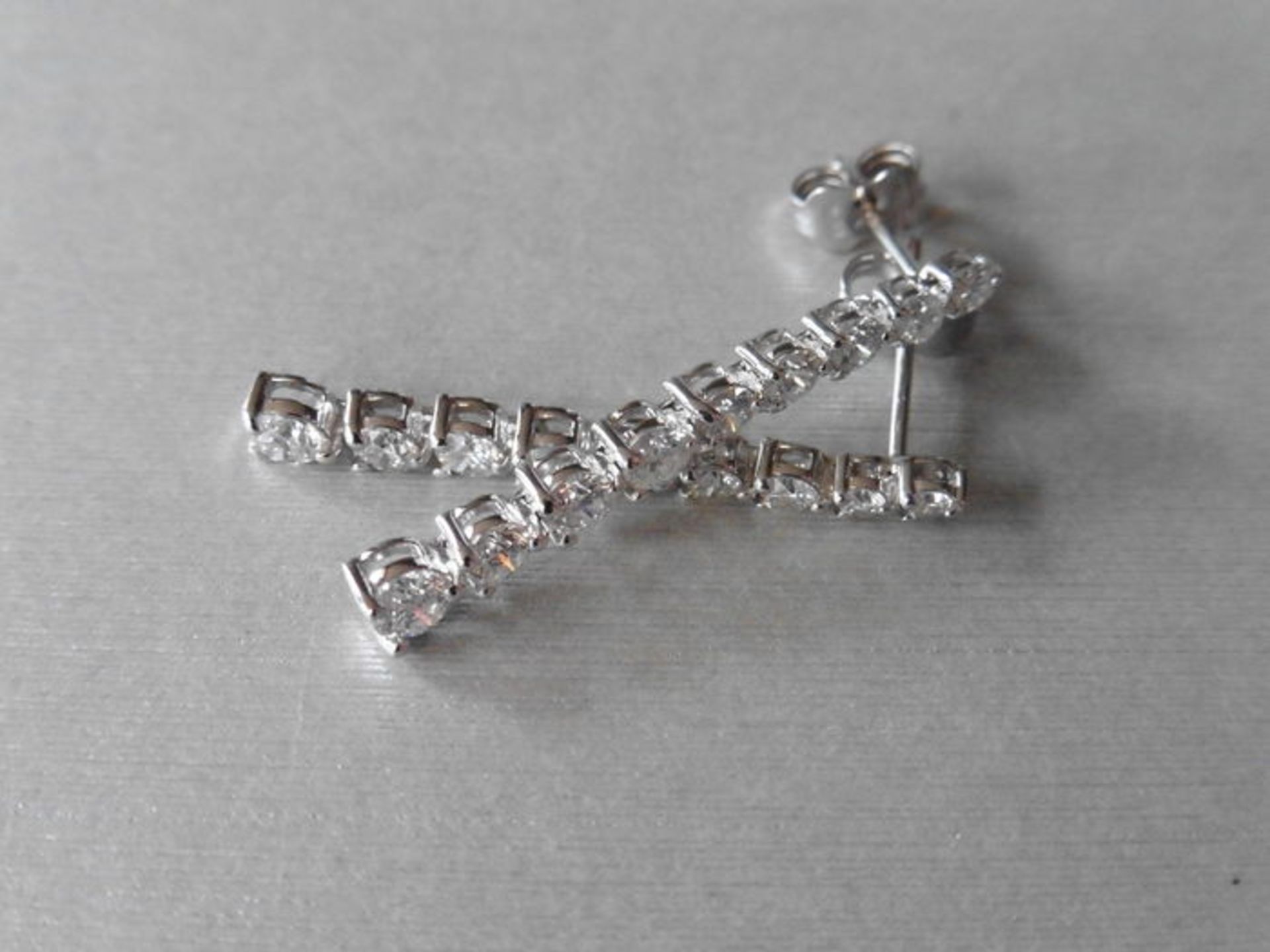 1.50ct graduated diamond drop earrings. Graduated brilliant cut diamonds, I colour weighing 1.50ct - Image 4 of 4