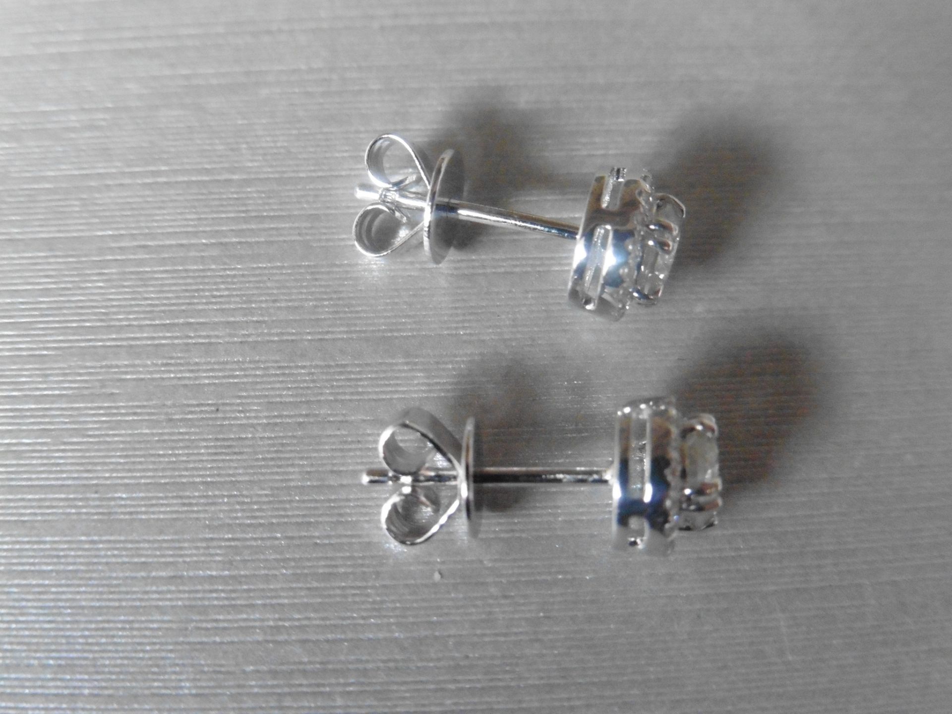 1.00ct diamond stud earrings each with a halo setting. 0.80ct total weight in the centre, H/I - Image 2 of 4