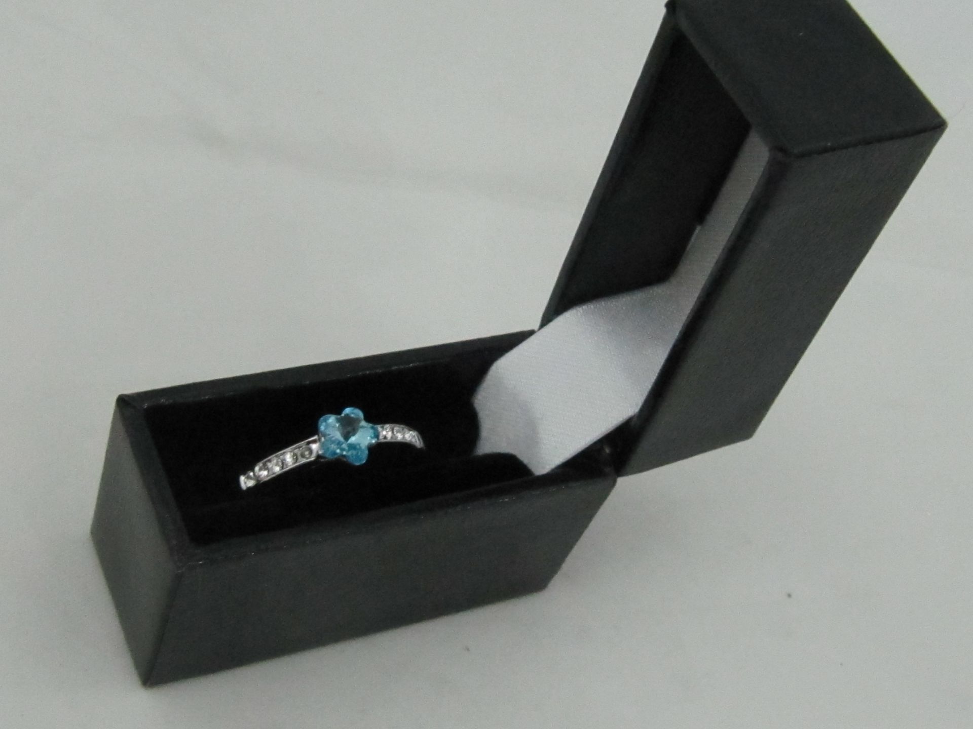 10k White Gold Filled with Blue Sapphire. Size N.