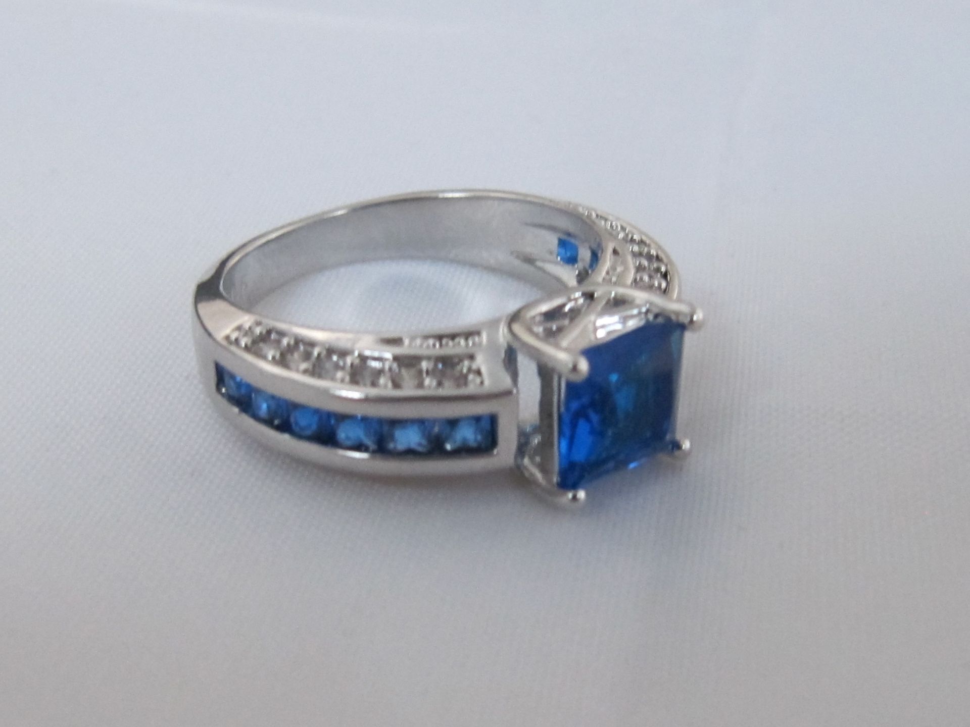 10k White Gold Filled with Blue Sapphires. Size R.