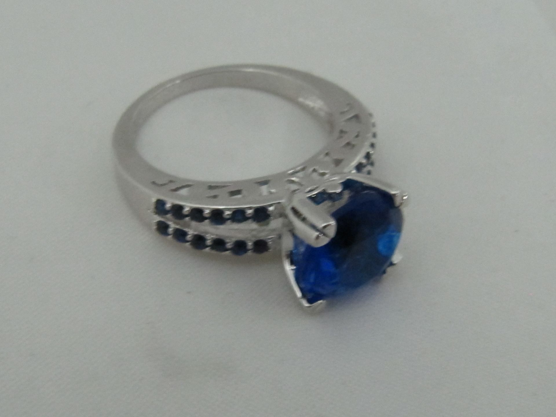 10k White Gold Filled with Blue Sapphires. Size P.