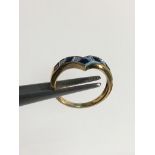 Ladies Gold Ring Set with Five sapphires and diamonds in a wishbone style